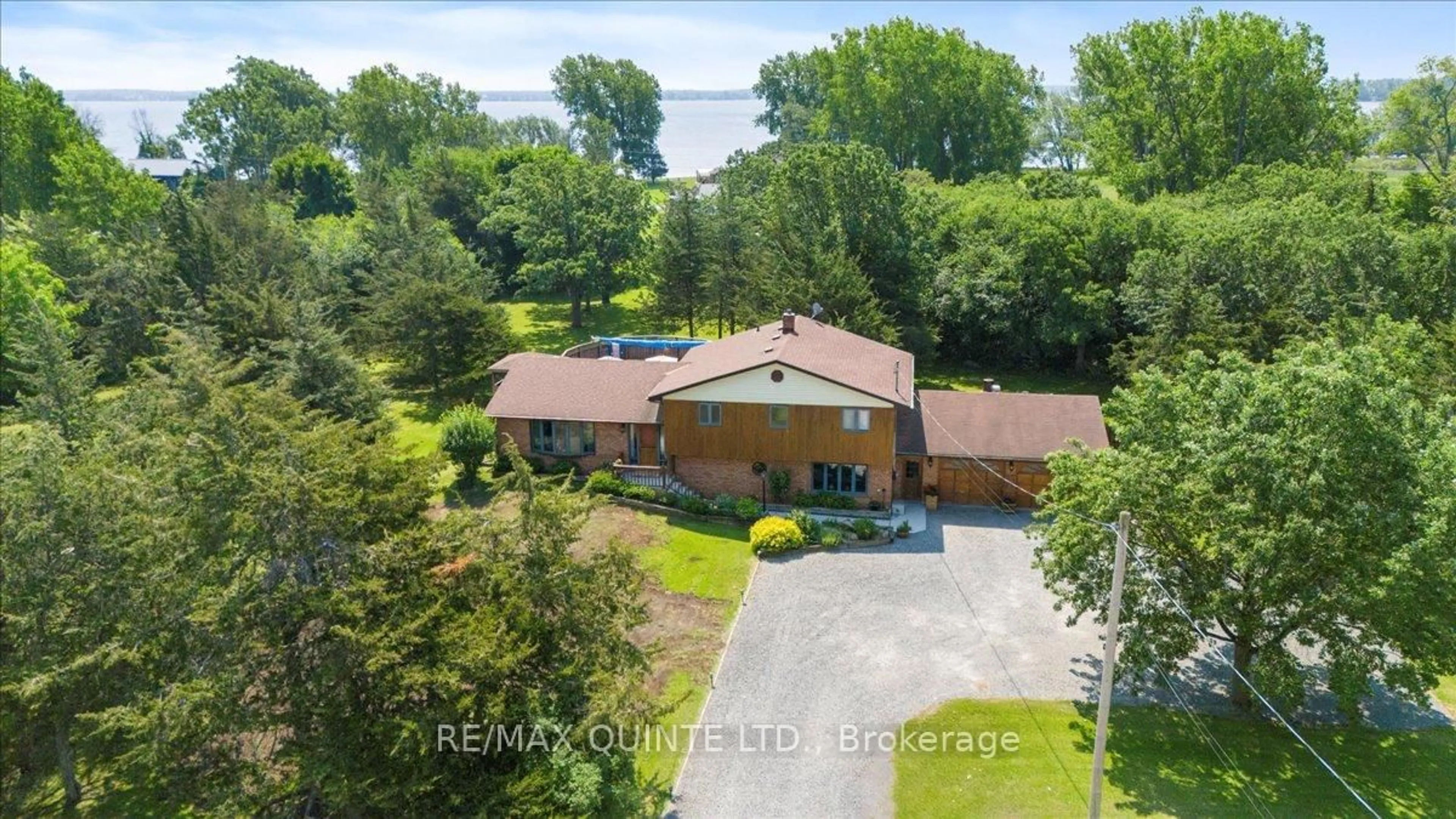 A pic from outside/outdoor area/front of a property/back of a property/a pic from drone, water/lake/river/ocean view for 338 Sunrise Dr, Prince Edward County Ontario K8N 4Z7