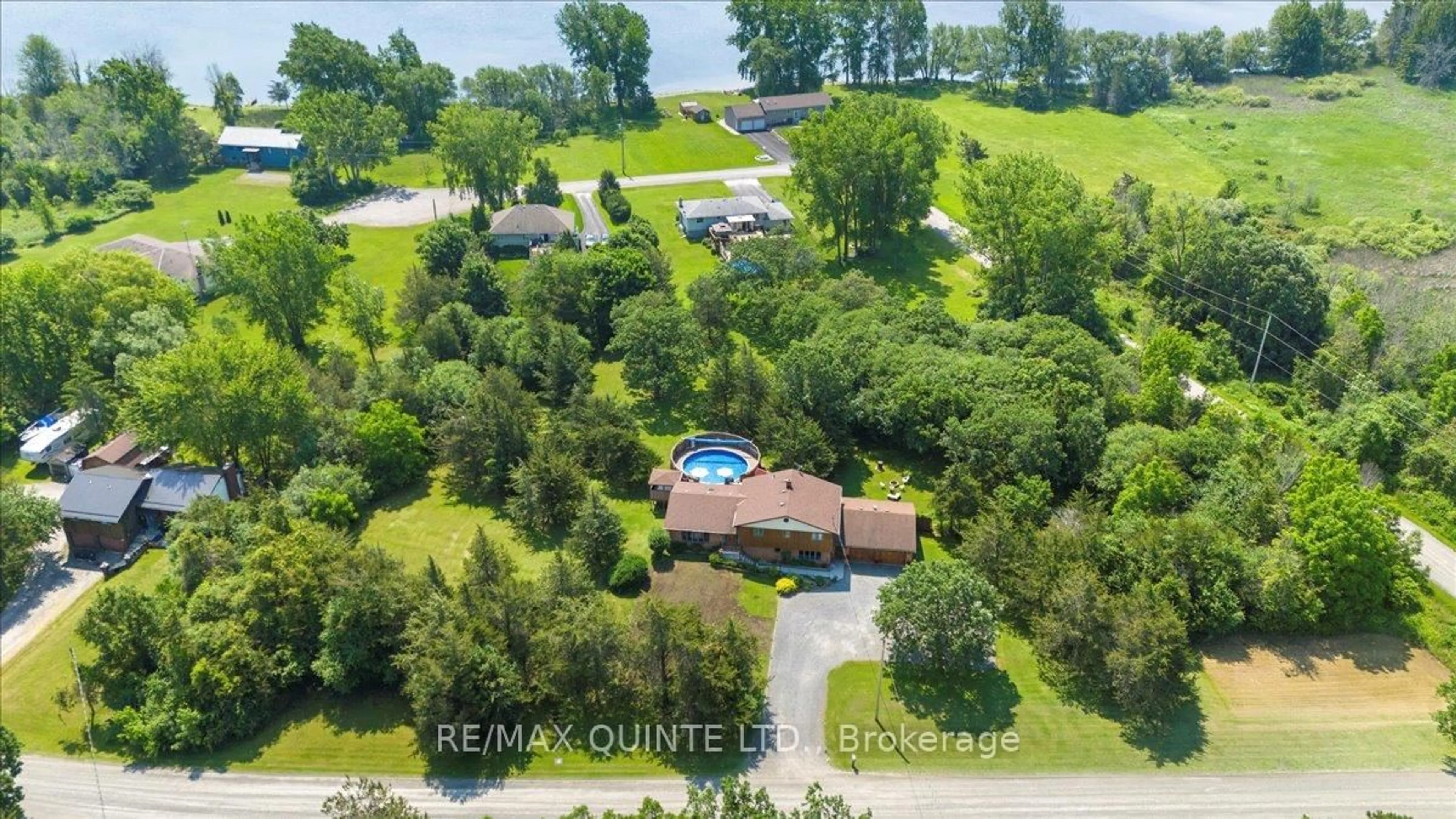 A pic from outside/outdoor area/front of a property/back of a property/a pic from drone, water/lake/river/ocean view for 338 Sunrise Dr, Prince Edward County Ontario K8N 4Z7