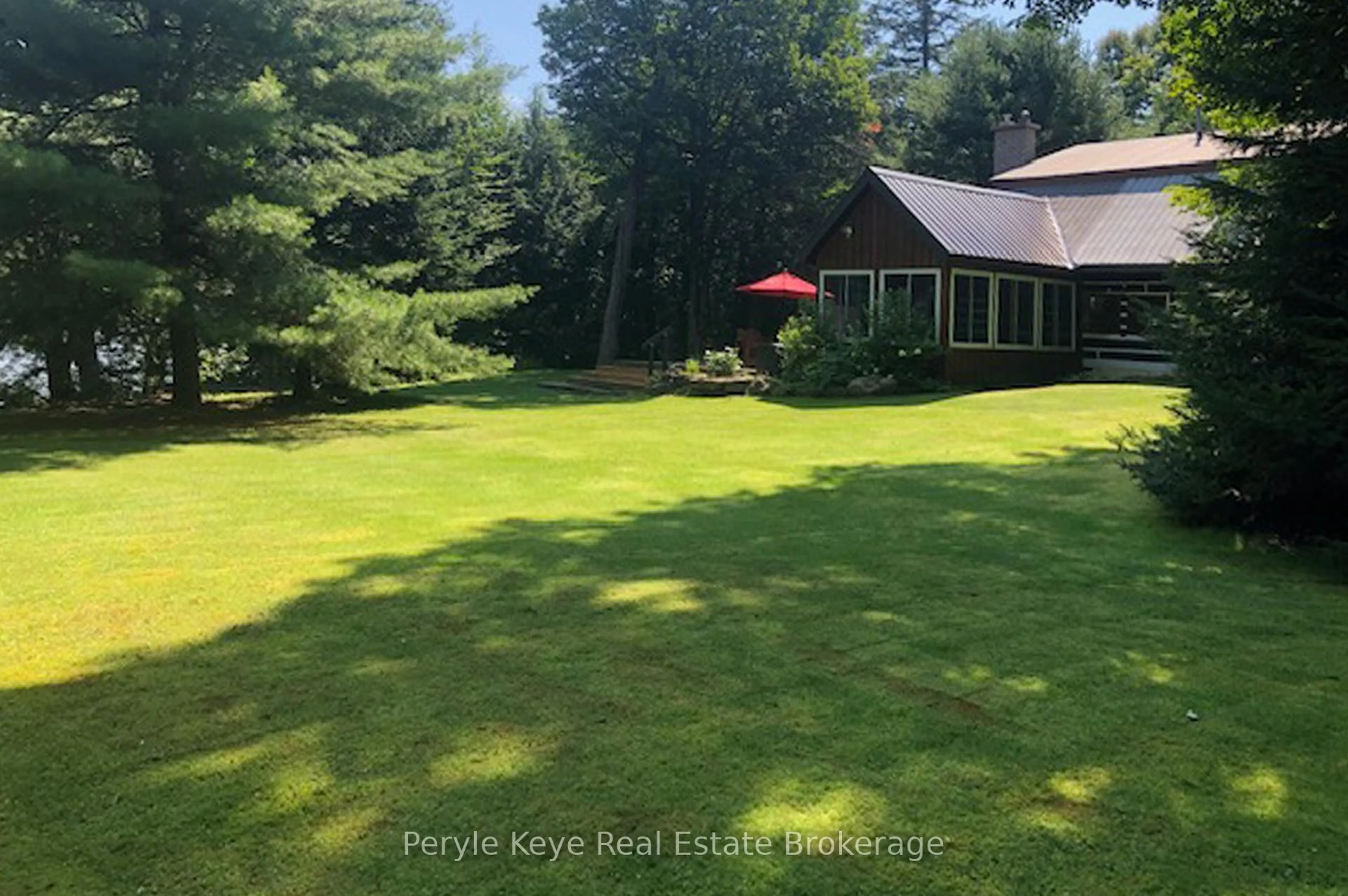 A pic from outside/outdoor area/front of a property/back of a property/a pic from drone, water/lake/river/ocean view for 2391 Limberlost Rd, Lake of Bays Ontario P1H 2J6