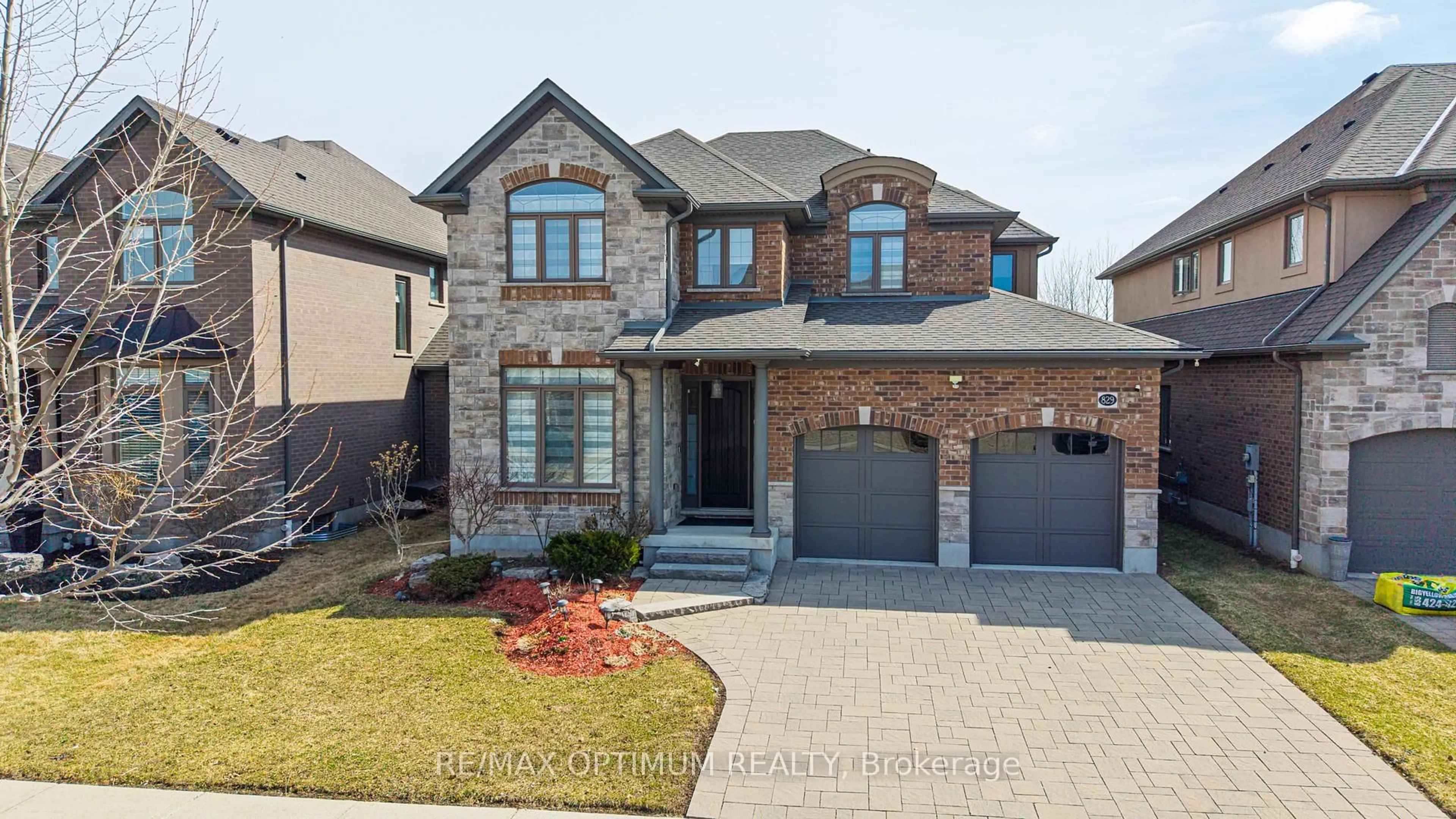 Home with brick exterior material, street for 829 COPPER RIDGE Dr, Waterloo Ontario N2K 0B5
