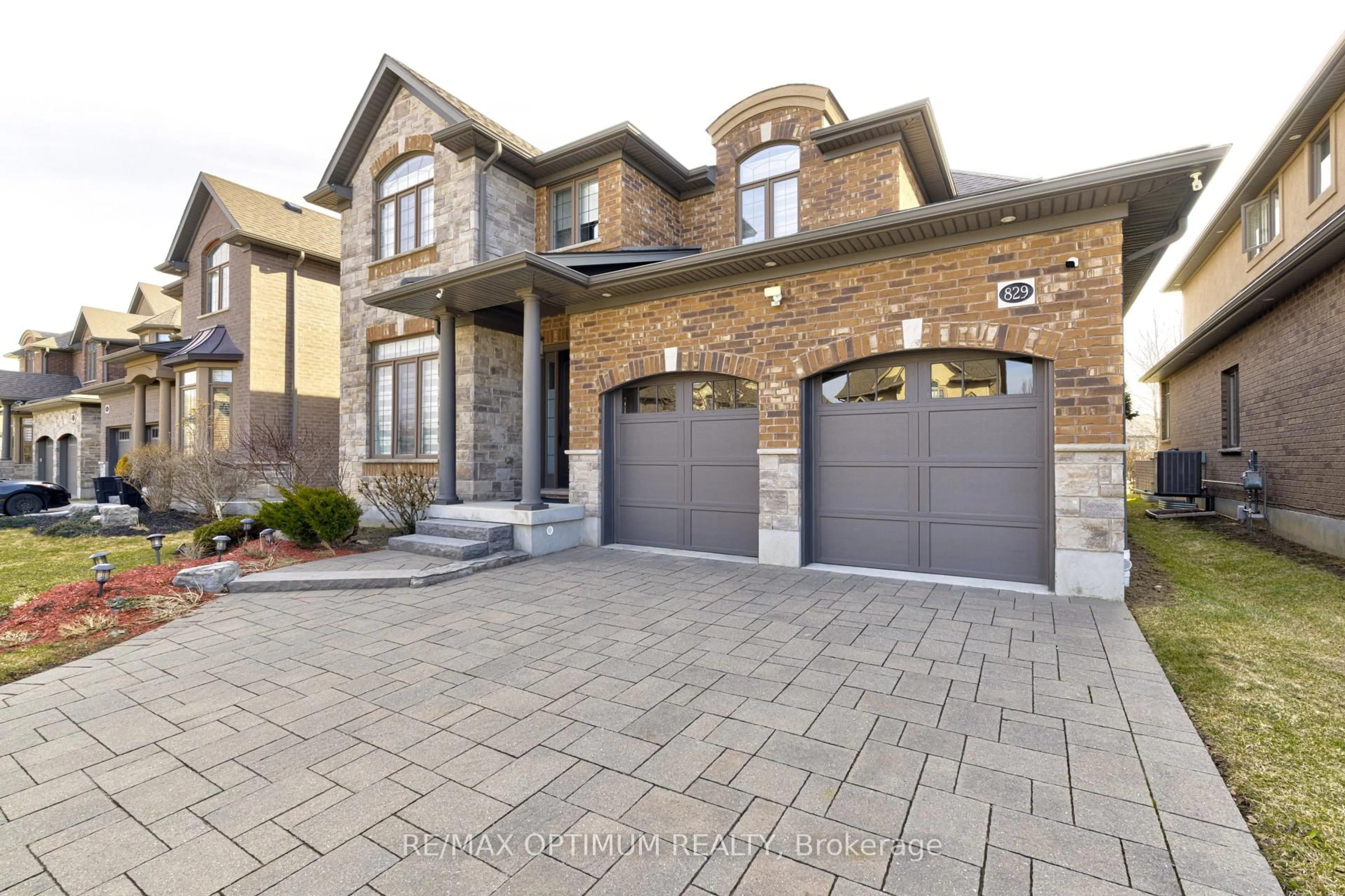 Home with brick exterior material, street for 829 COPPER RIDGE Dr, Waterloo Ontario N2K 0B5