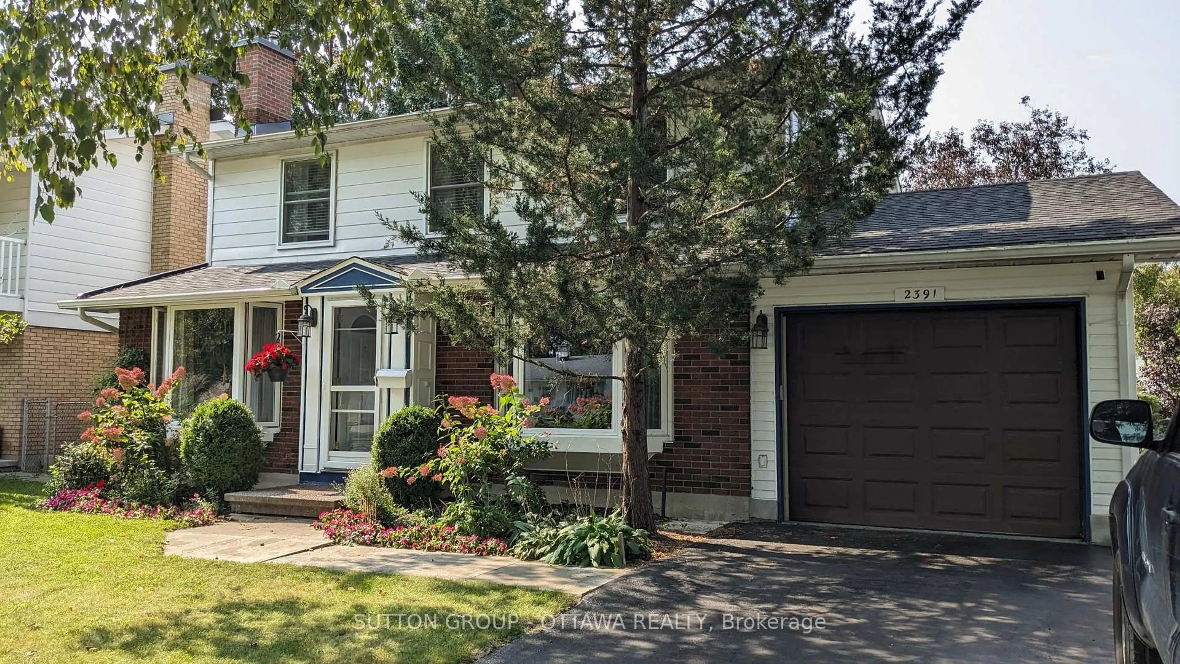 Home with brick exterior material, street for 2391 Ogilvie Rd, Ottawa Ontario K1J 7N4