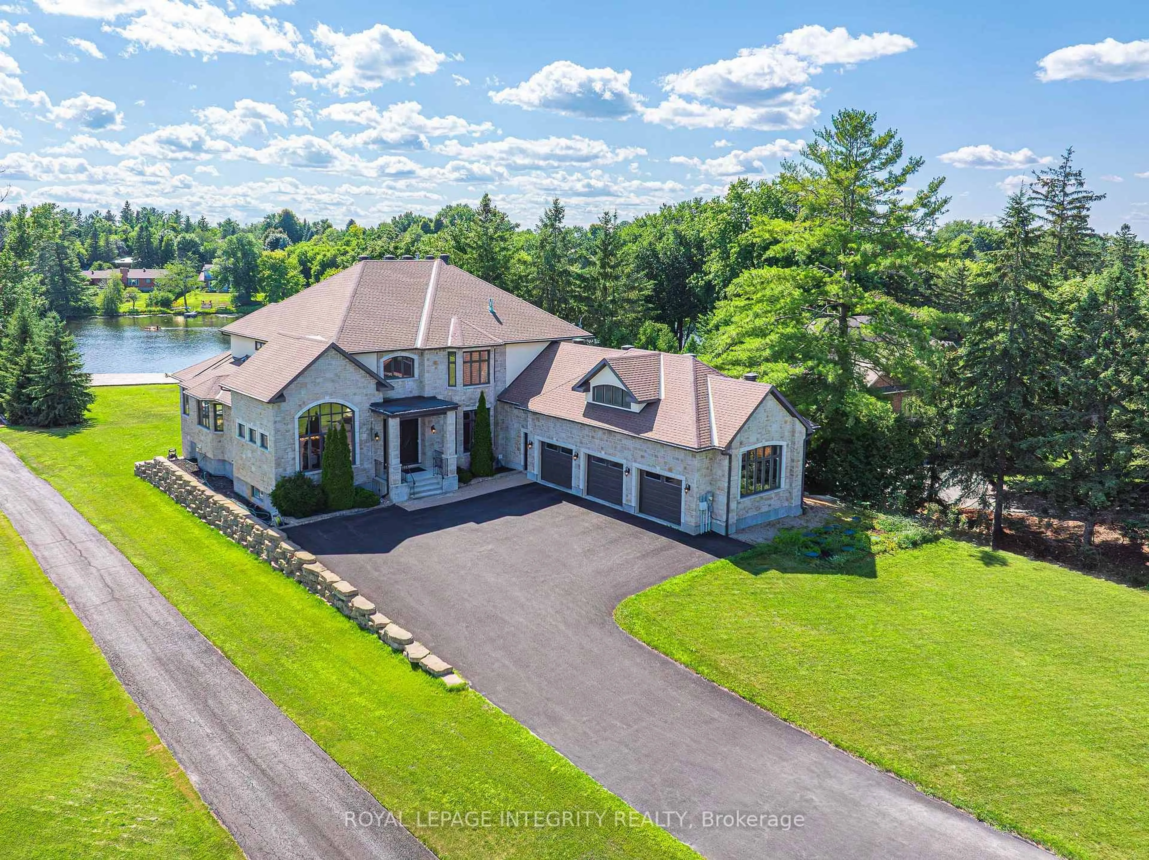 A pic from outside/outdoor area/front of a property/back of a property/a pic from drone, water/lake/river/ocean view for 1180 River Rd, Ottawa Ontario K4M 1B4
