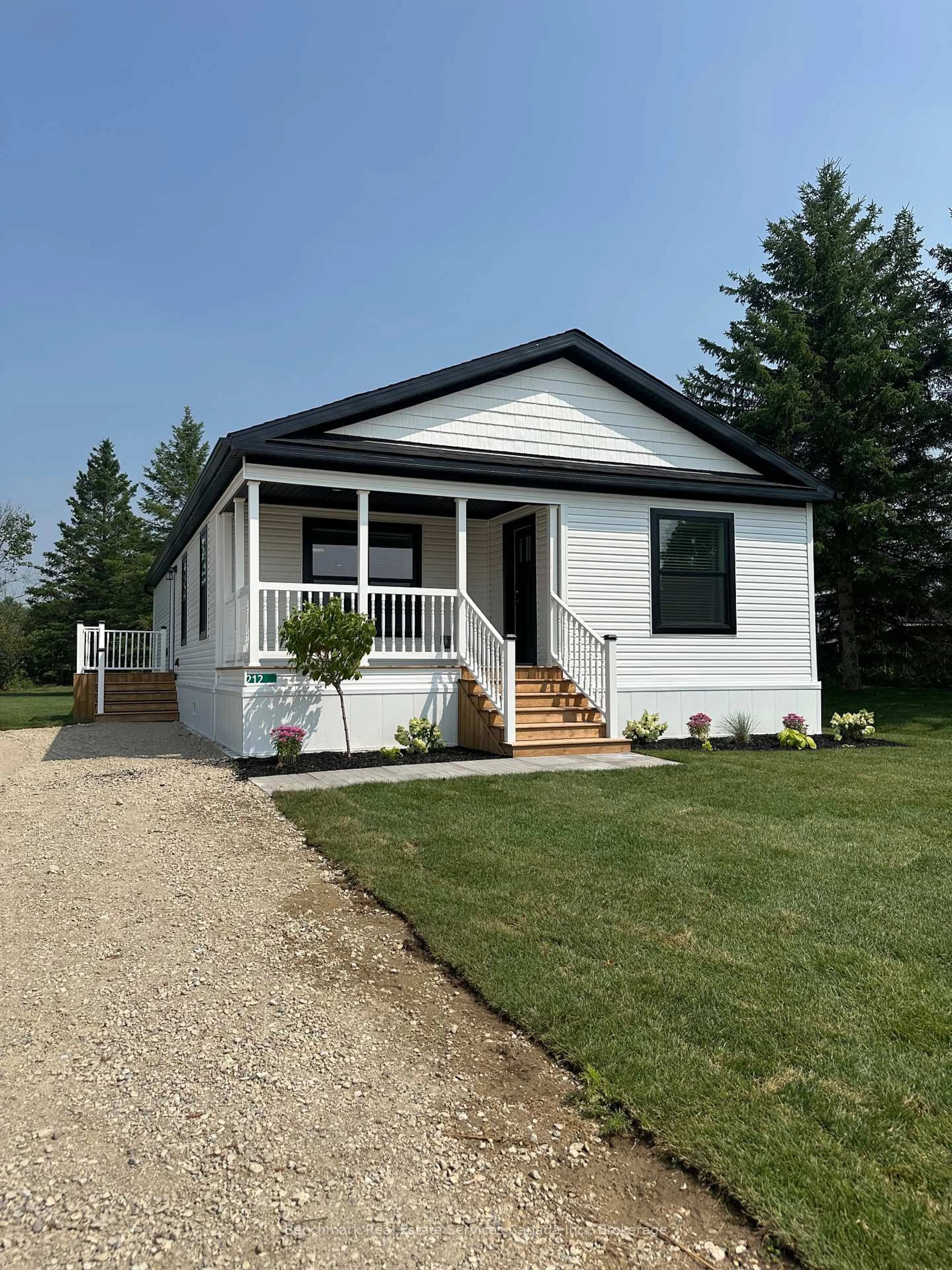 Home with vinyl exterior material, street for 212 SPRUCE Dr, West Grey Ontario N4N 3B8