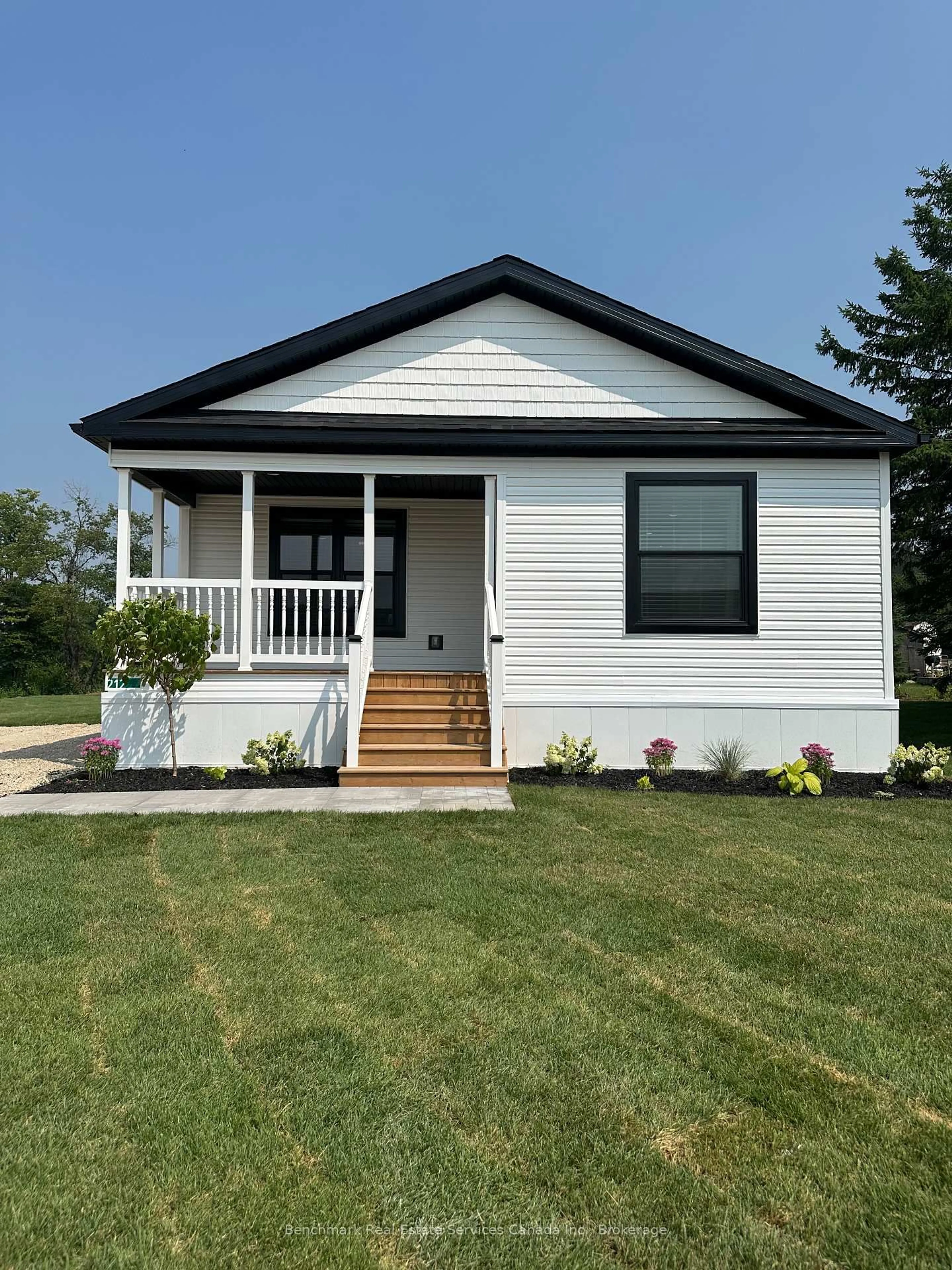 Home with vinyl exterior material, street for 212 SPRUCE Dr, West Grey Ontario N4N 3B8