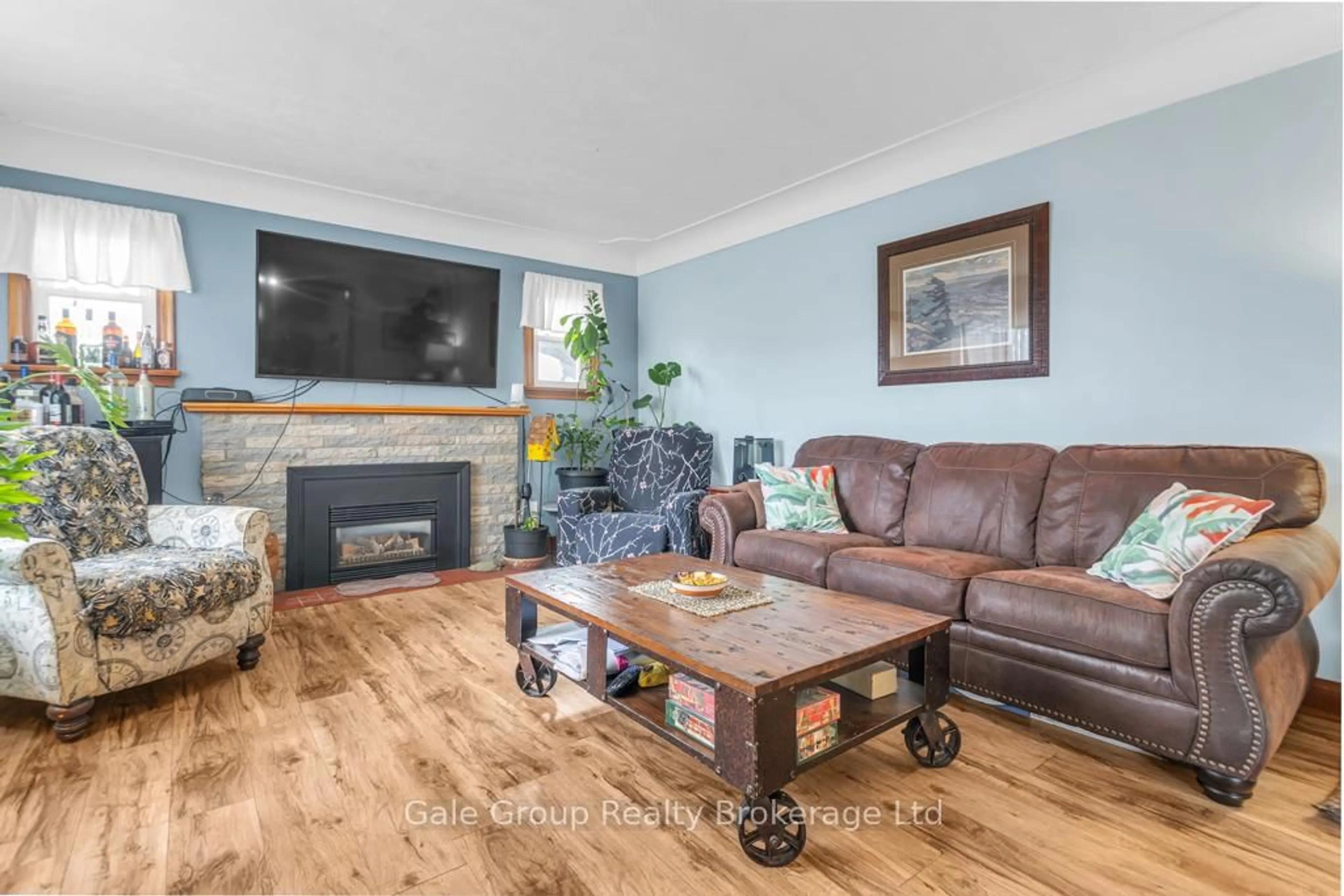 Living room with furniture, wood/laminate floor for 8827 Plank Rd, Bayham Ontario N0J 1Y0