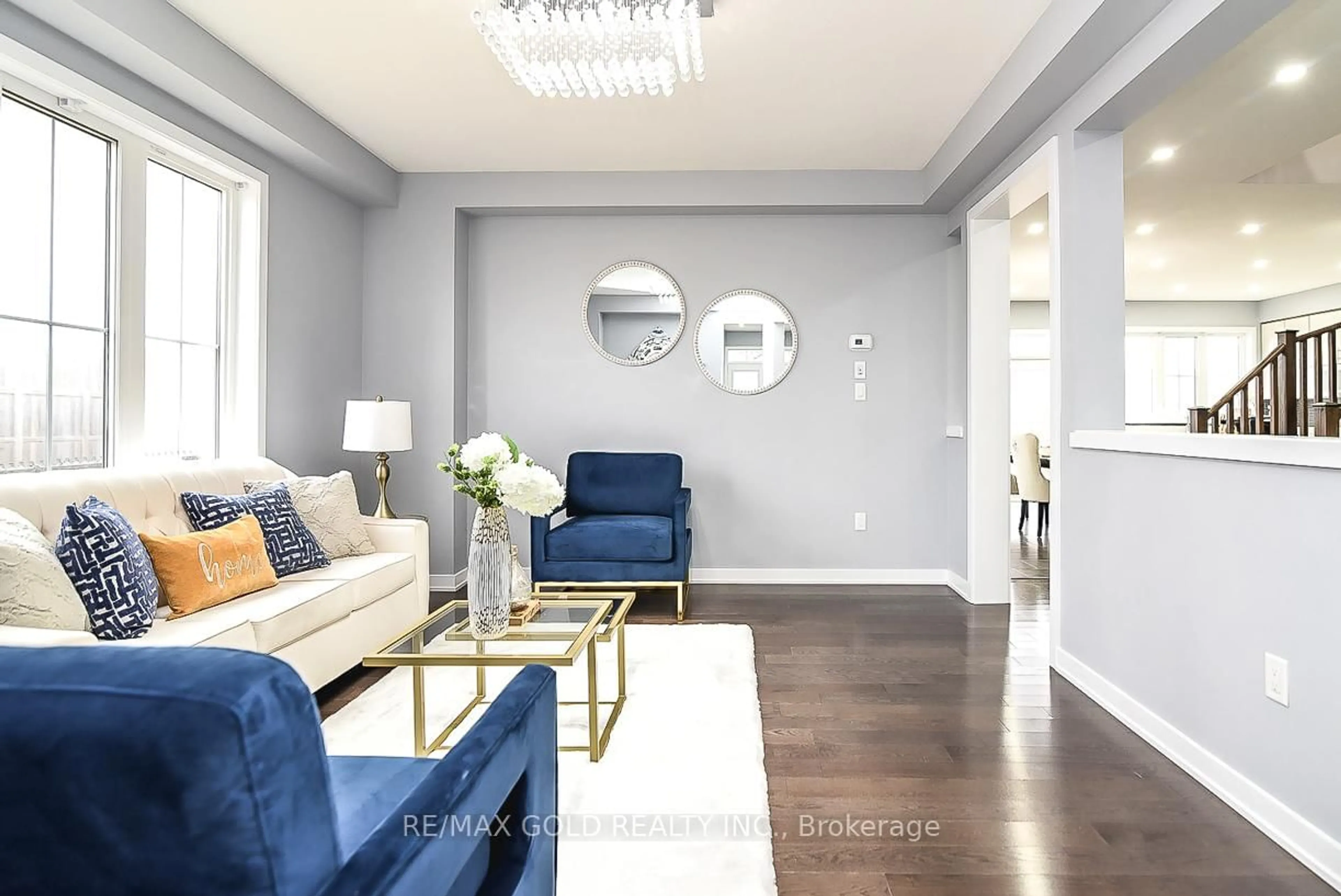 Living room with furniture, wood/laminate floor for 206 Crafter Cres, Hamilton Ontario L8J 0J1