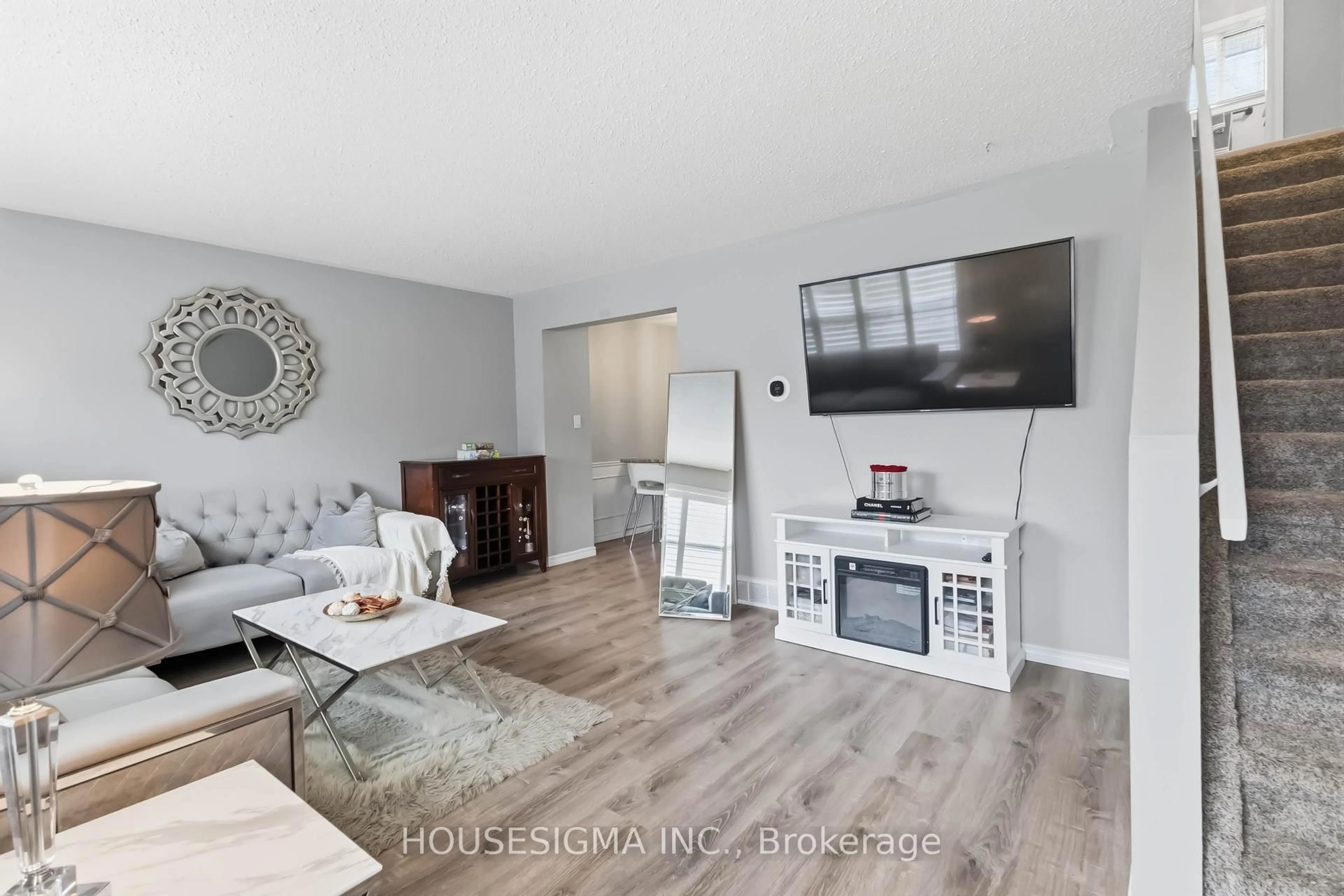 Living room with furniture, wood/laminate floor for 861 DEARNESS Dr, London South Ontario N6E 1Y4