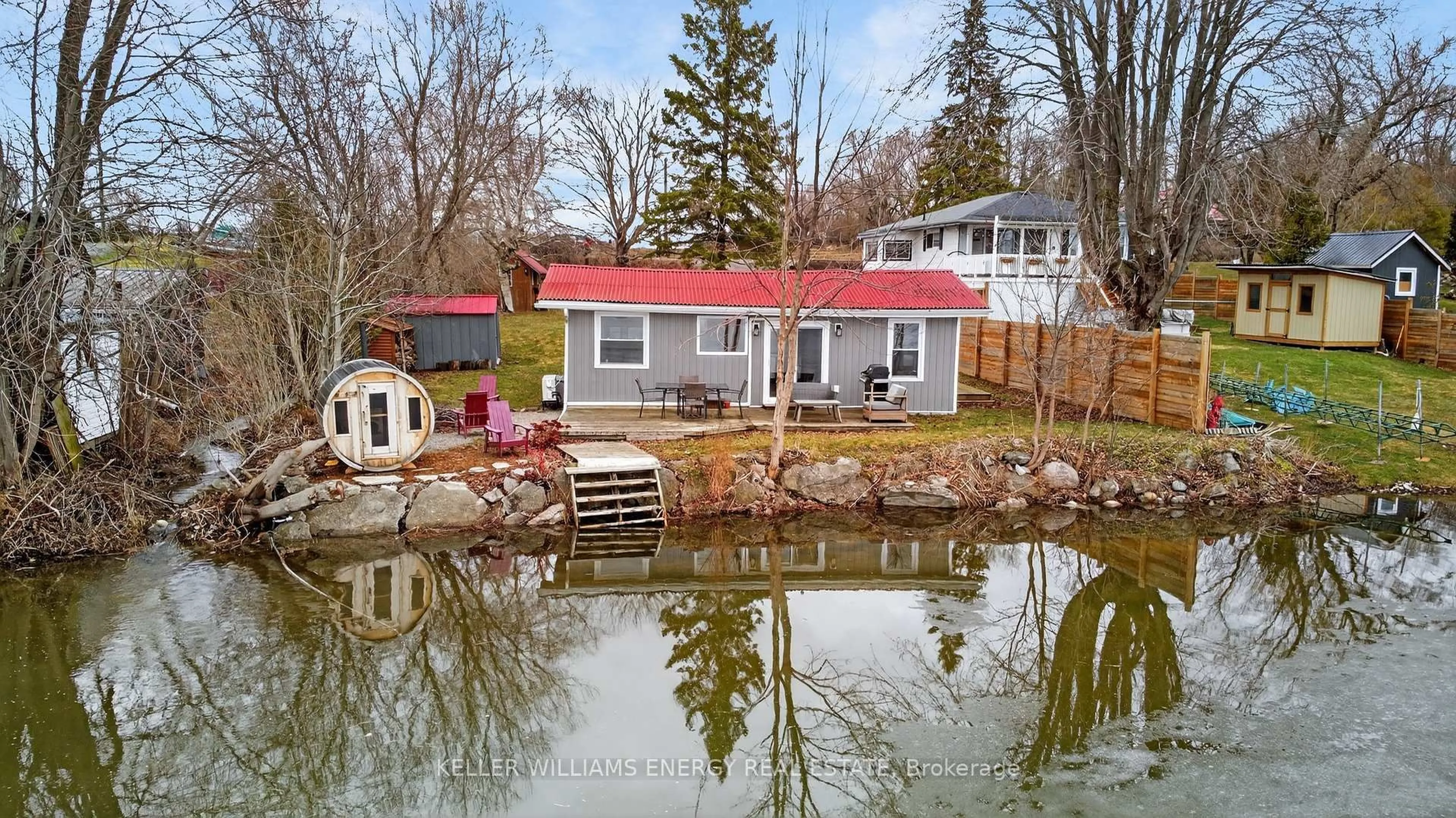 A pic from outside/outdoor area/front of a property/back of a property/a pic from drone, water/lake/river/ocean view for 1071C Lakeside Dr, Prince Edward County Ontario K0K 1T0