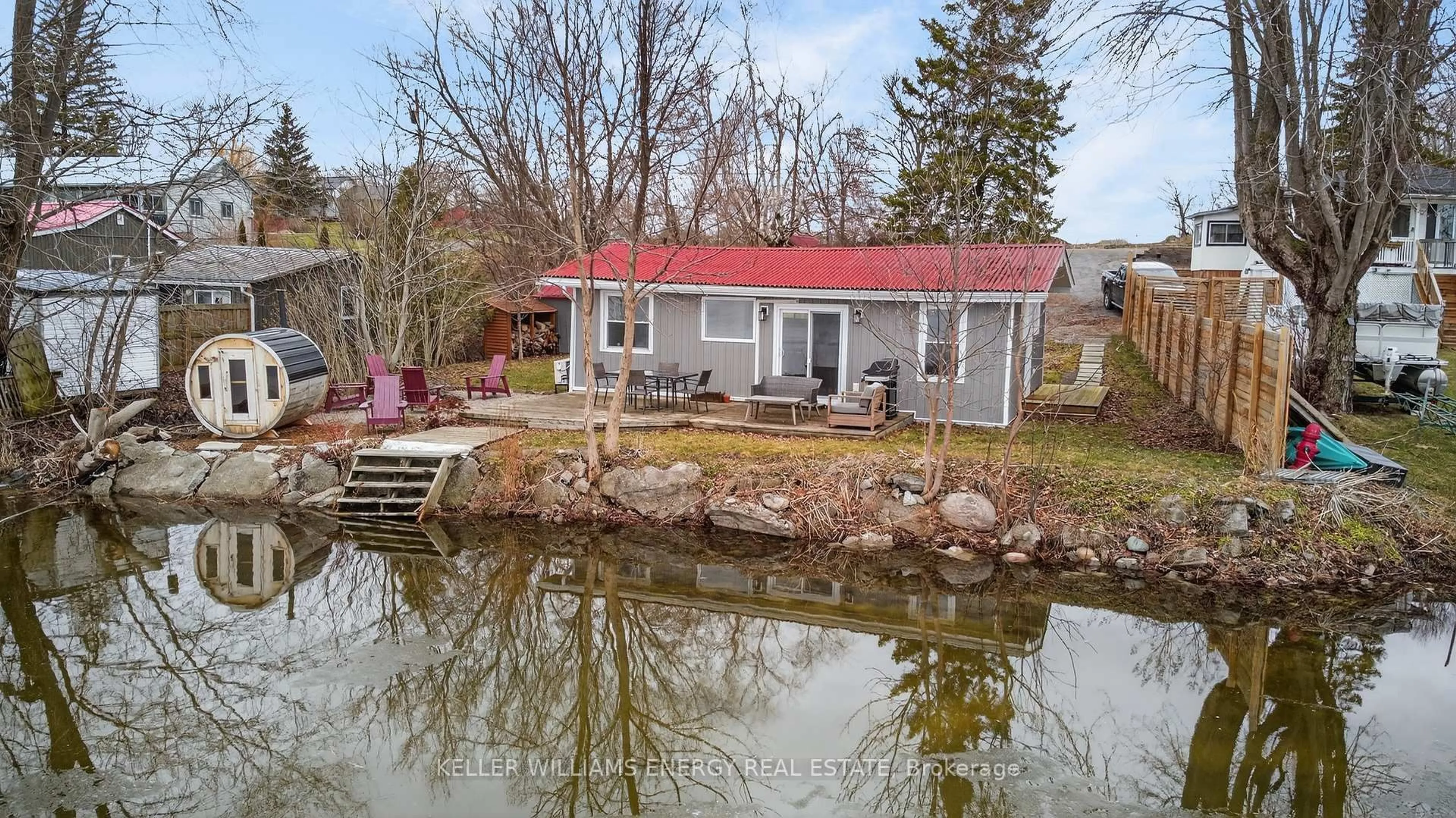 A pic from outside/outdoor area/front of a property/back of a property/a pic from drone, water/lake/river/ocean view for 1071C Lakeside Dr, Prince Edward County Ontario K0K 1T0