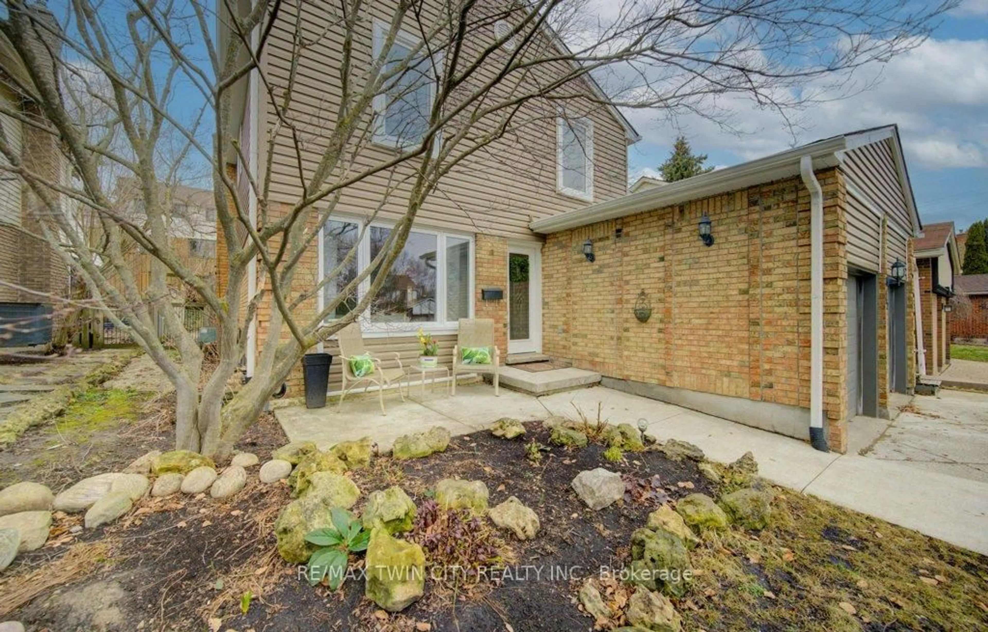 Home with brick exterior material, street for 15 Deerwood Cres, Kitchener Ontario N2N 1R4