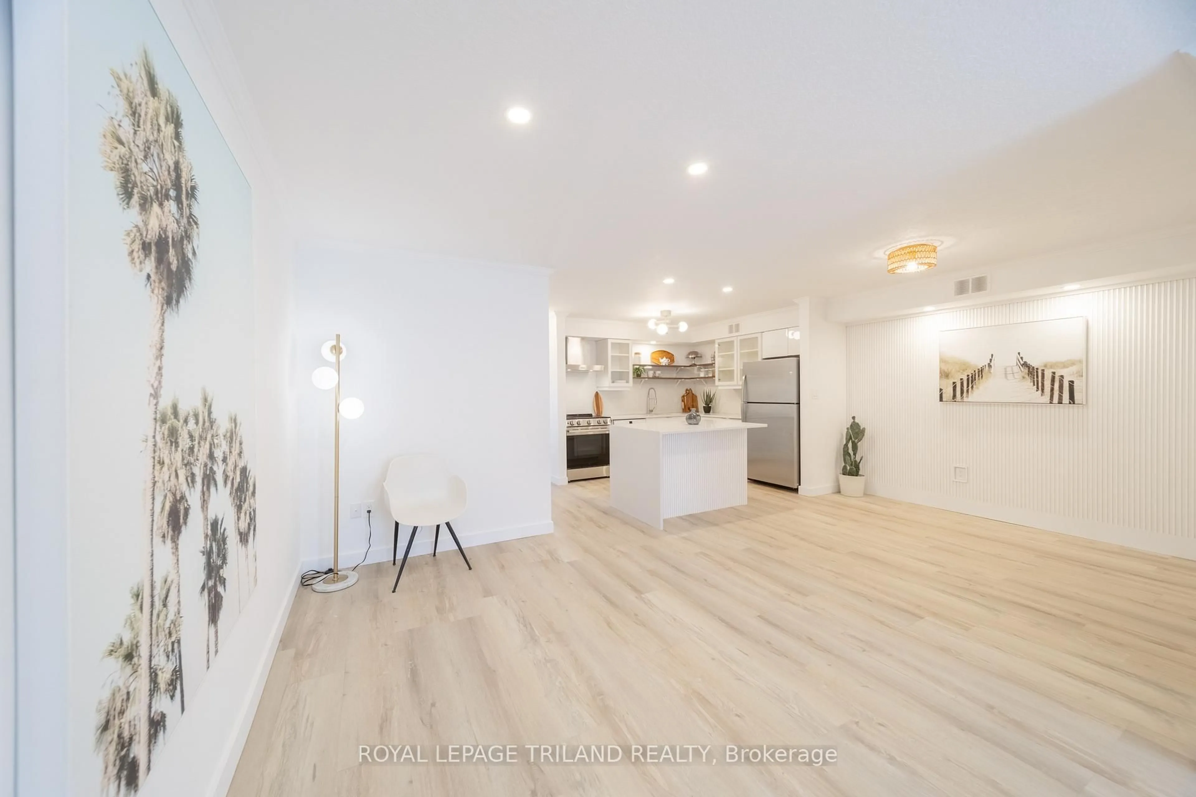 Open concept kitchen, wood/laminate floor for 8 Oak St #7, Lambton Shores Ontario N0M 1T0