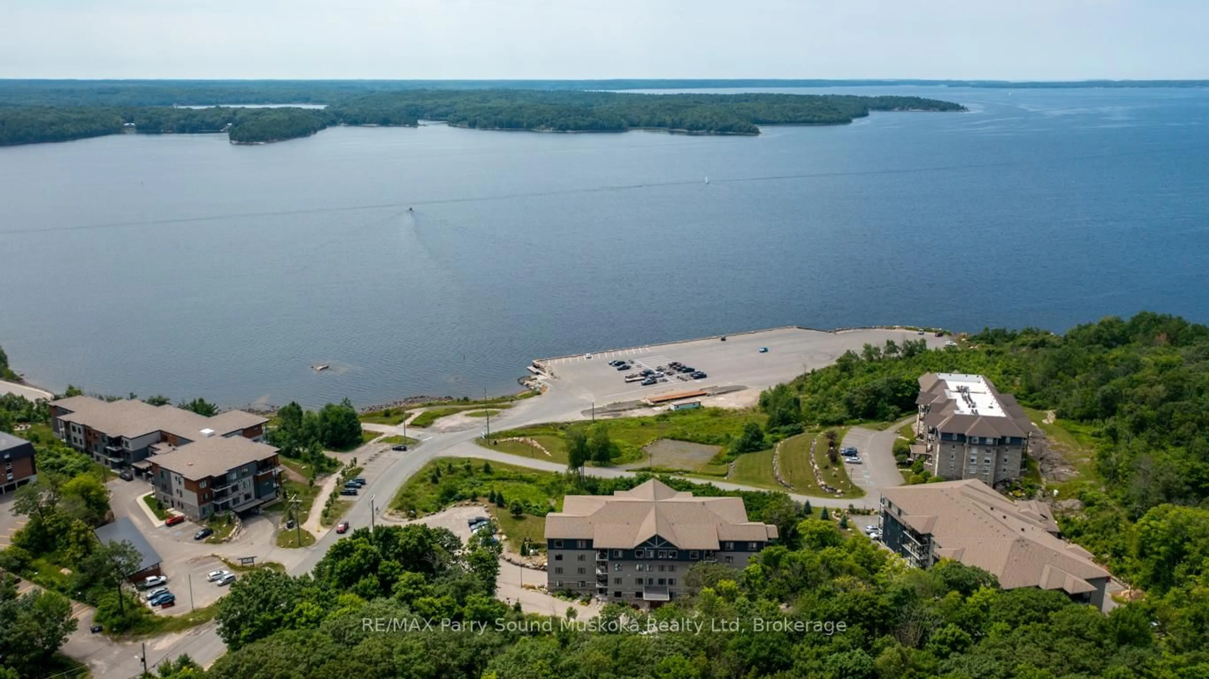 A pic from outside/outdoor area/front of a property/back of a property/a pic from drone, water/lake/river/ocean view for 11A Salt Dock Rd #101, Parry Sound Ontario P2A 3B6