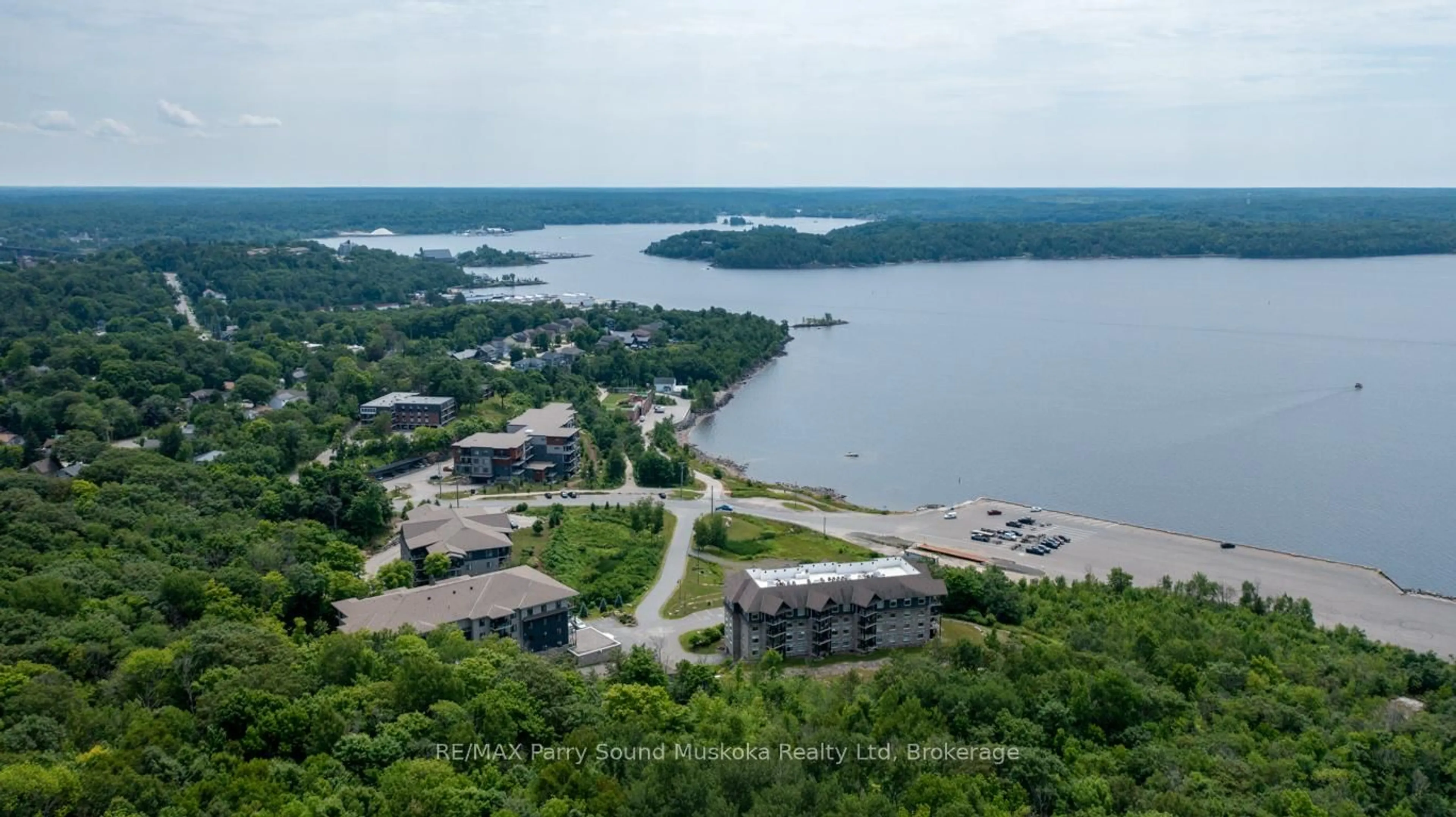 A pic from outside/outdoor area/front of a property/back of a property/a pic from drone, water/lake/river/ocean view for 11A Salt Dock Rd #101, Parry Sound Ontario P2A 3B6