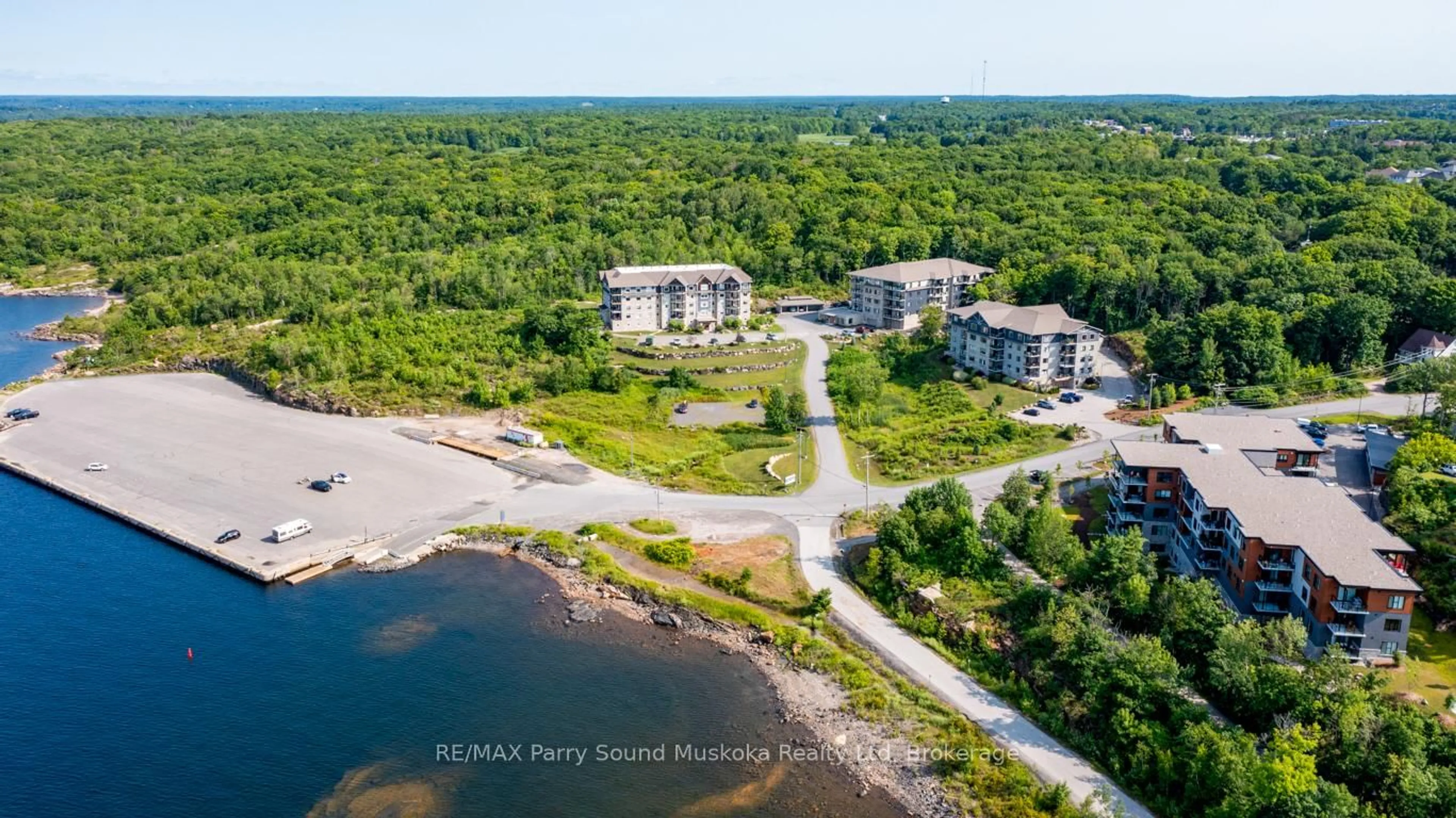 A pic from outside/outdoor area/front of a property/back of a property/a pic from drone, water/lake/river/ocean view for 11A Salt Dock Rd #101, Parry Sound Ontario P2A 3B6