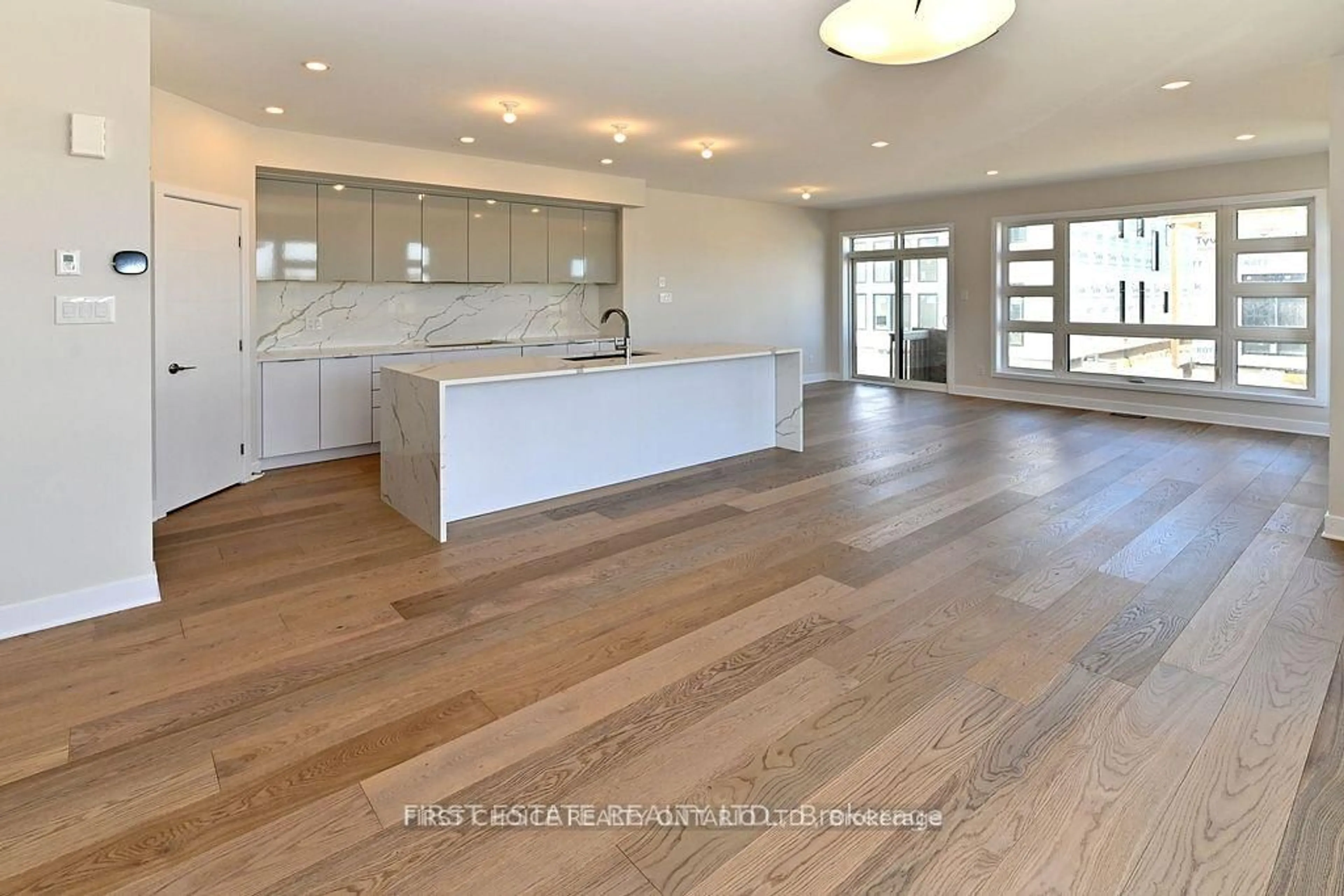 Open concept kitchen, wood/laminate floor for 964 Acoustic Way, Ottawa Ontario K4M 0R1