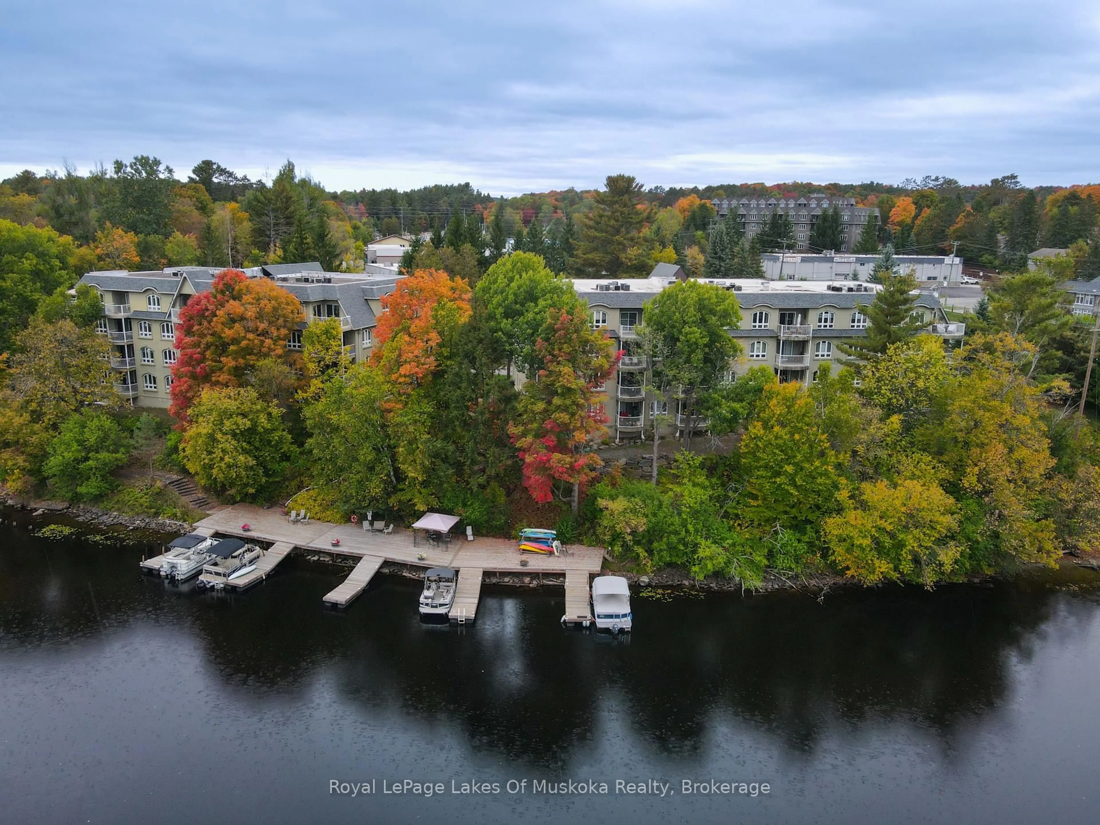 A pic from outside/outdoor area/front of a property/back of a property/a pic from drone, water/lake/river/ocean view for 31 Dairy Lane #106, Huntsville Ontario P1H 2L7