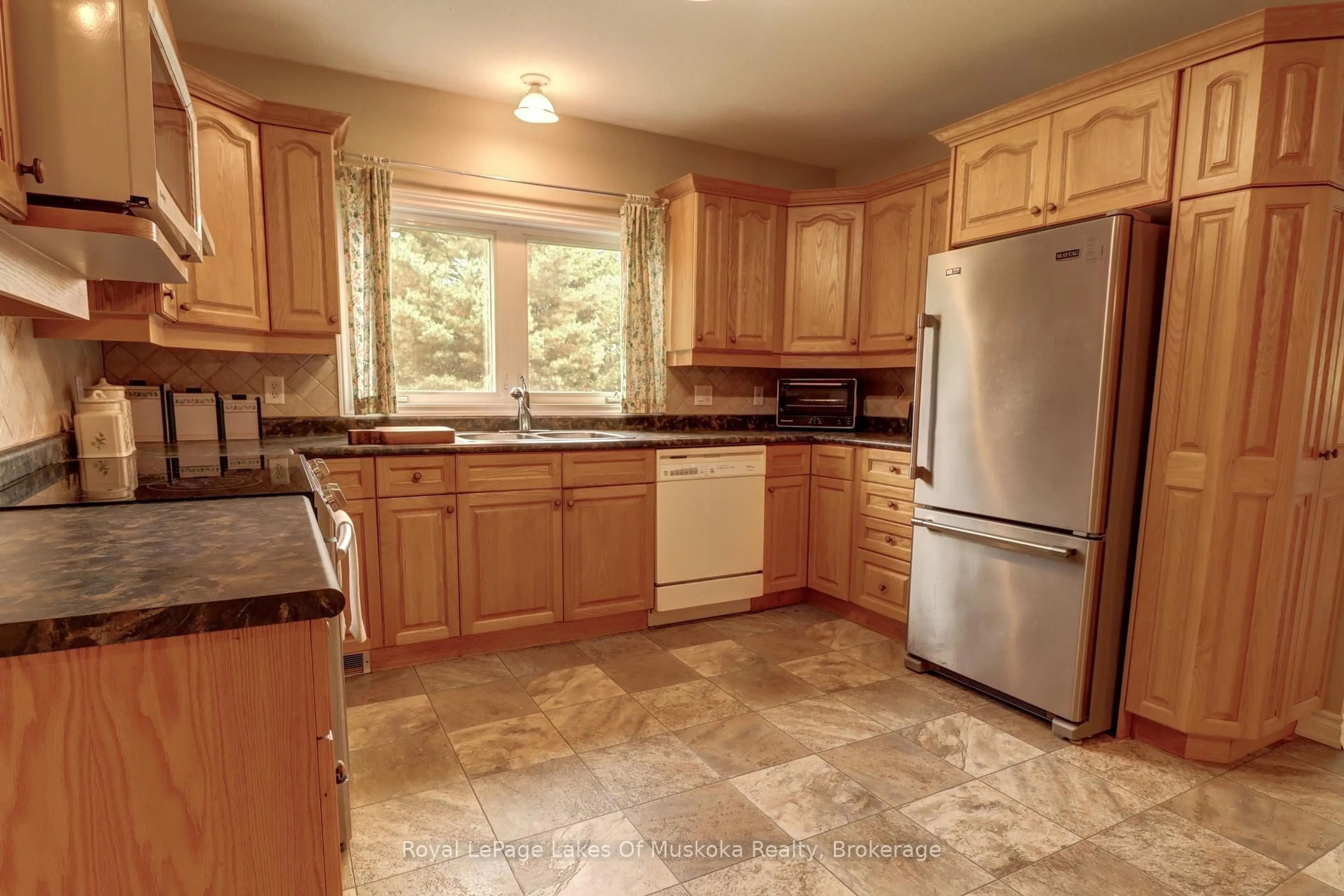 Standard kitchen, ceramic/tile floor for 31 Dairy Lane #106, Huntsville Ontario P1H 2L7