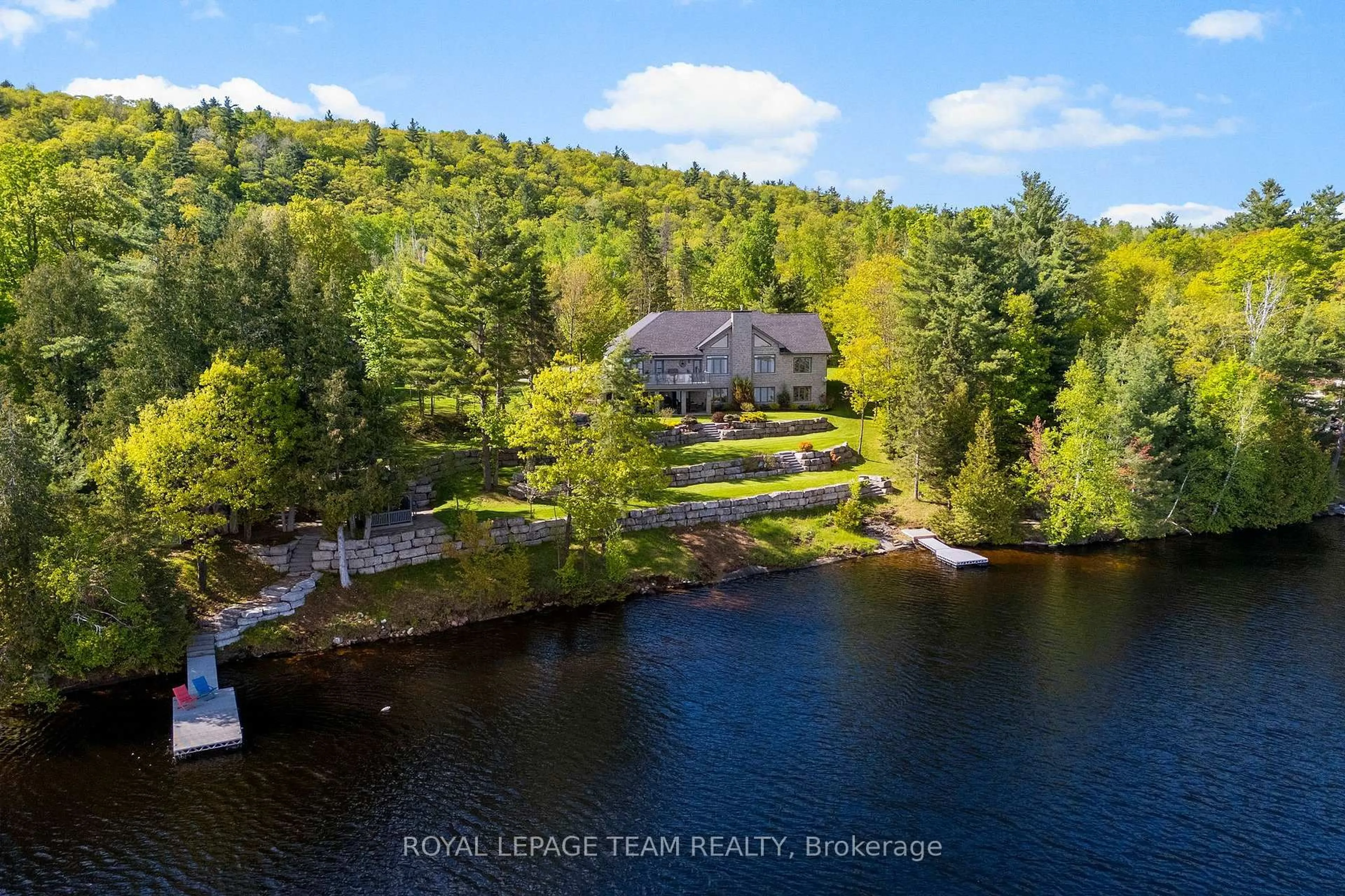 A pic from outside/outdoor area/front of a property/back of a property/a pic from drone, water/lake/river/ocean view for 2803 Centennial Lake Rd, Calabogie Ontario K0J 1H0