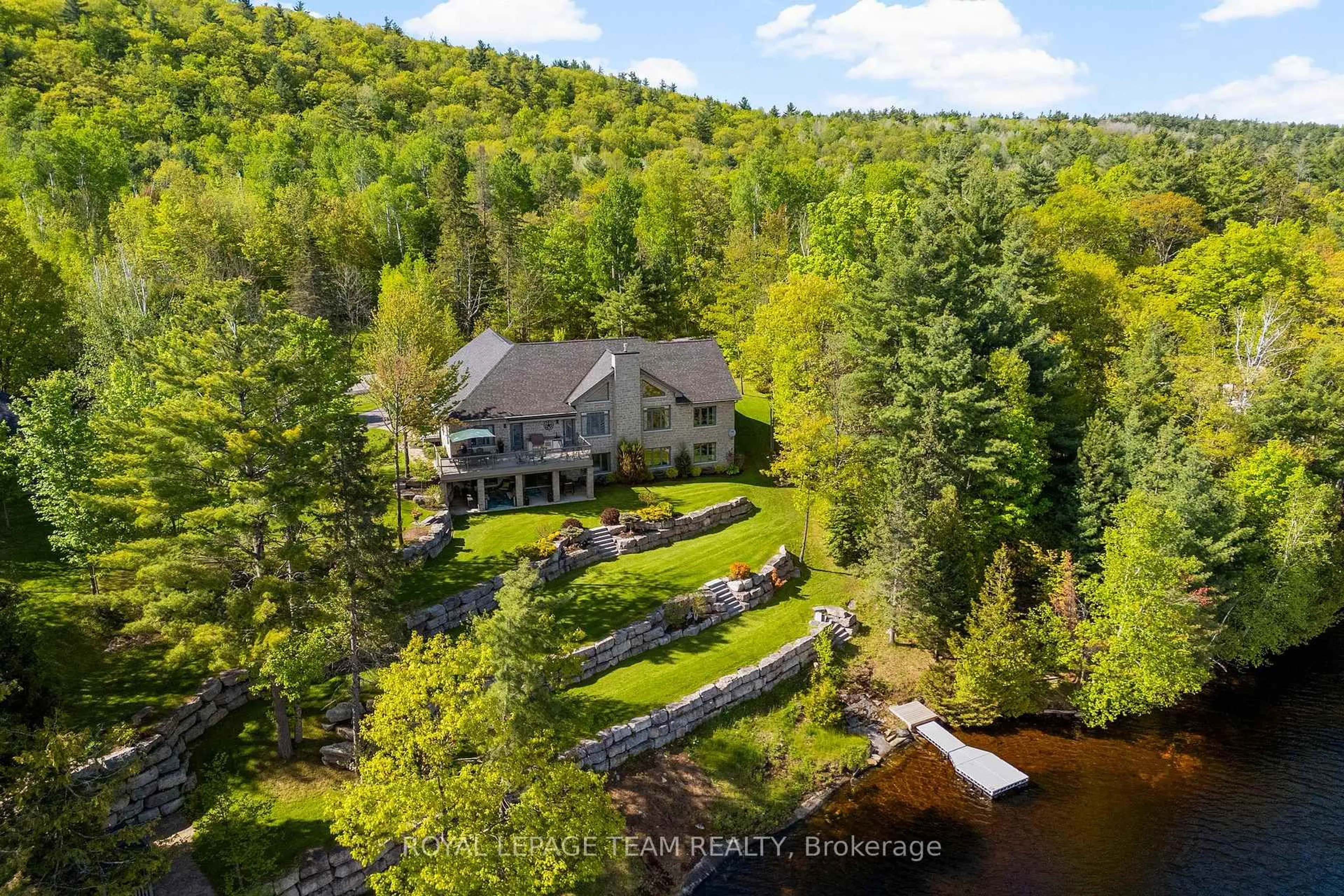 A pic from outside/outdoor area/front of a property/back of a property/a pic from drone, water/lake/river/ocean view for 2803 Centennial Lake Rd, Calabogie Ontario K0J 1H0