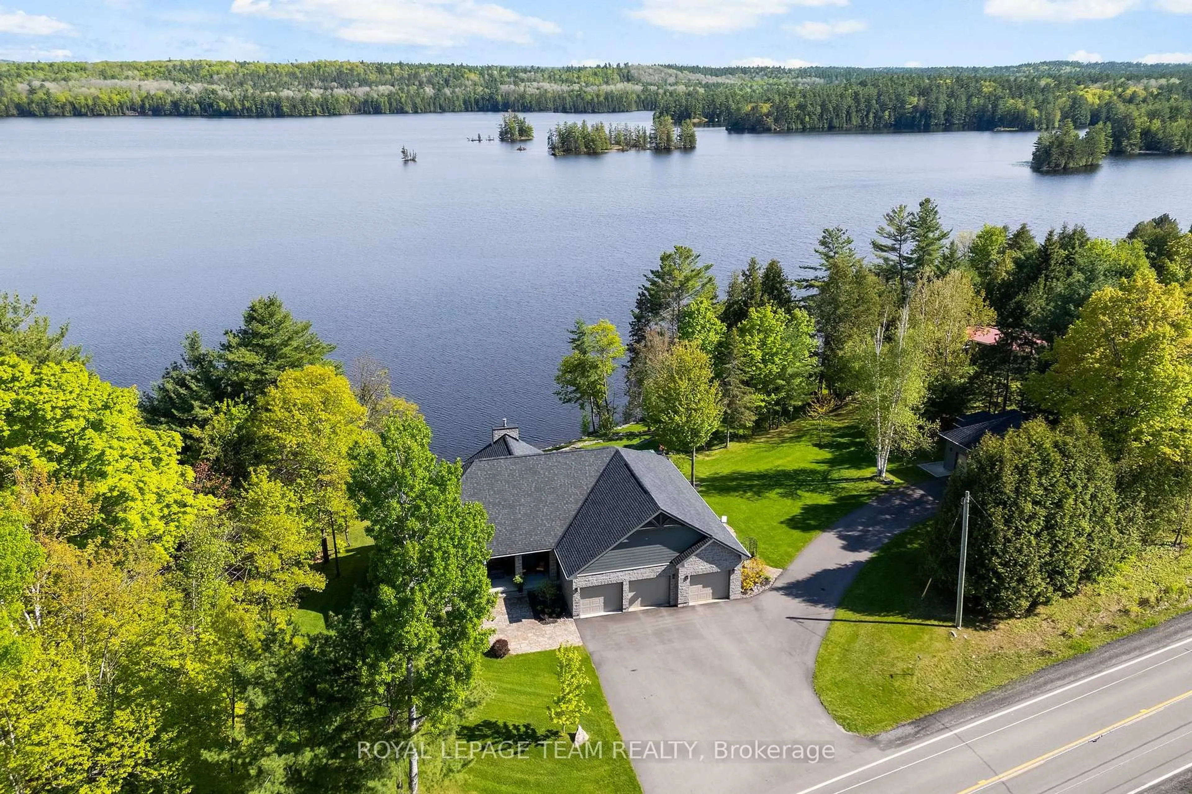 A pic from outside/outdoor area/front of a property/back of a property/a pic from drone, water/lake/river/ocean view for 2803 Centennial Lake Rd, Calabogie Ontario K0J 1H0