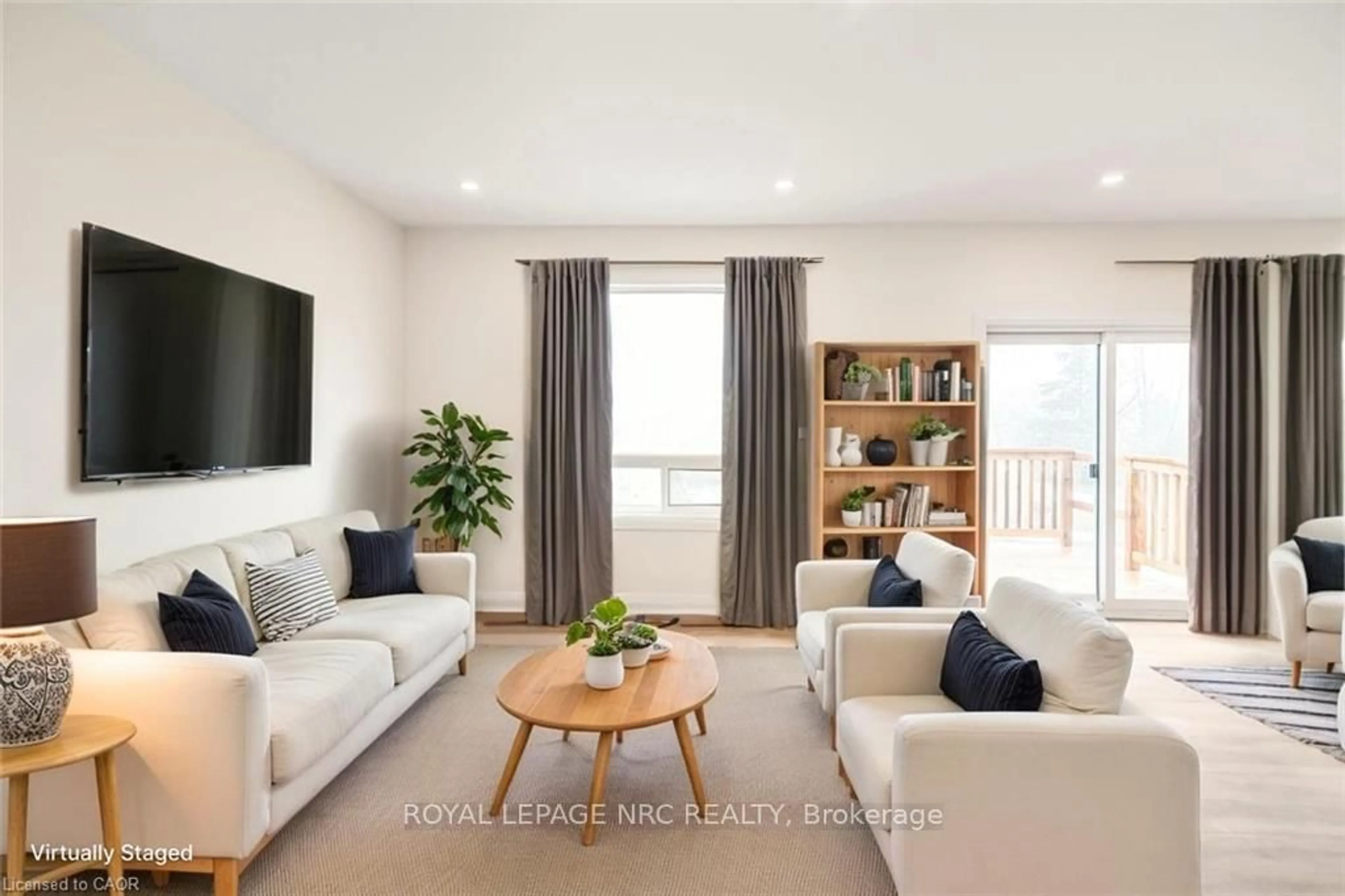 Living room with furniture, wood/laminate floor for 4180 Fly Rd, Lincoln Ontario L0R 1G0