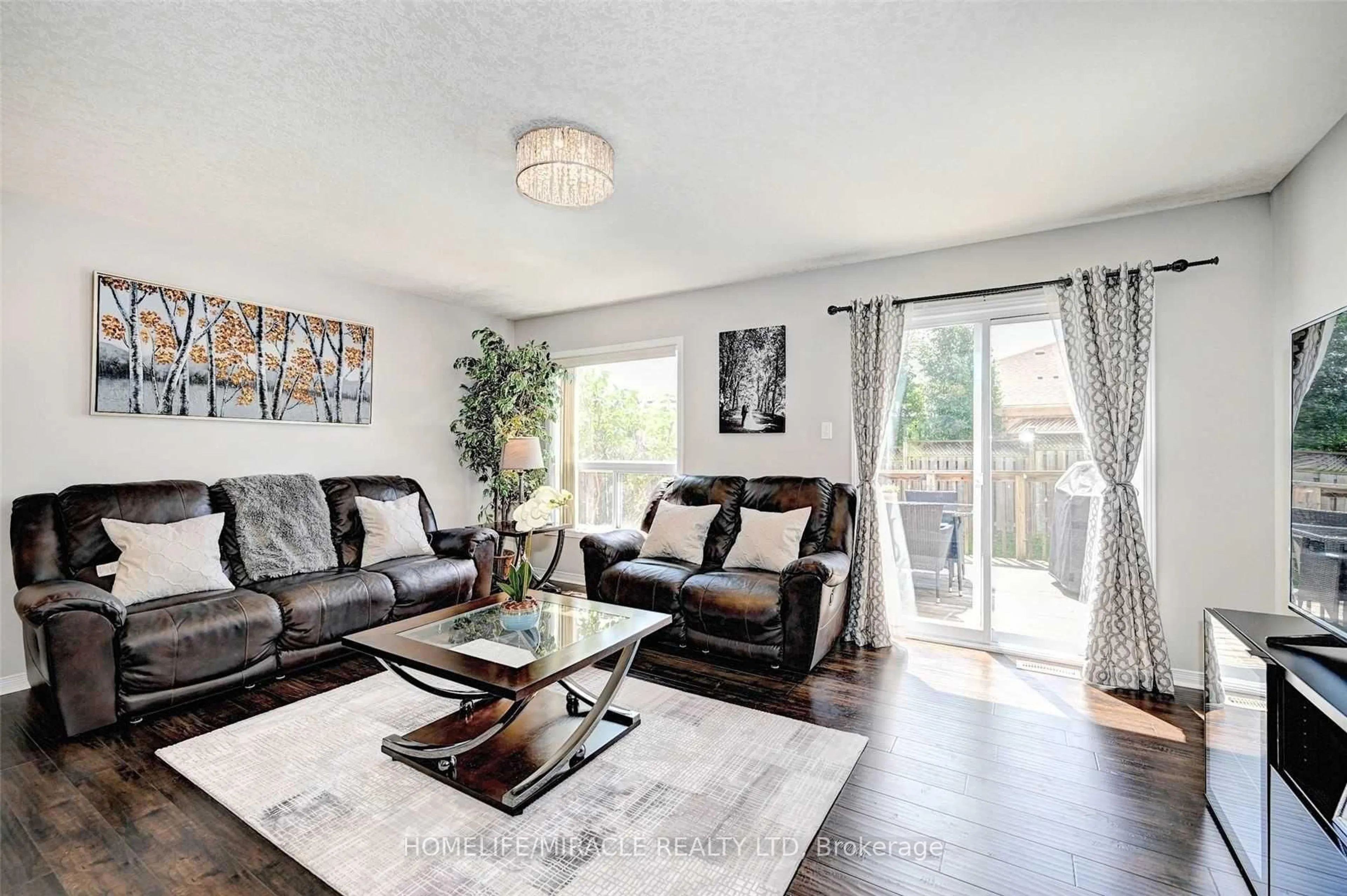 Living room with furniture, wood/laminate floor for 130 Upper Mercer St, Kitchener Ontario N2A 4N2