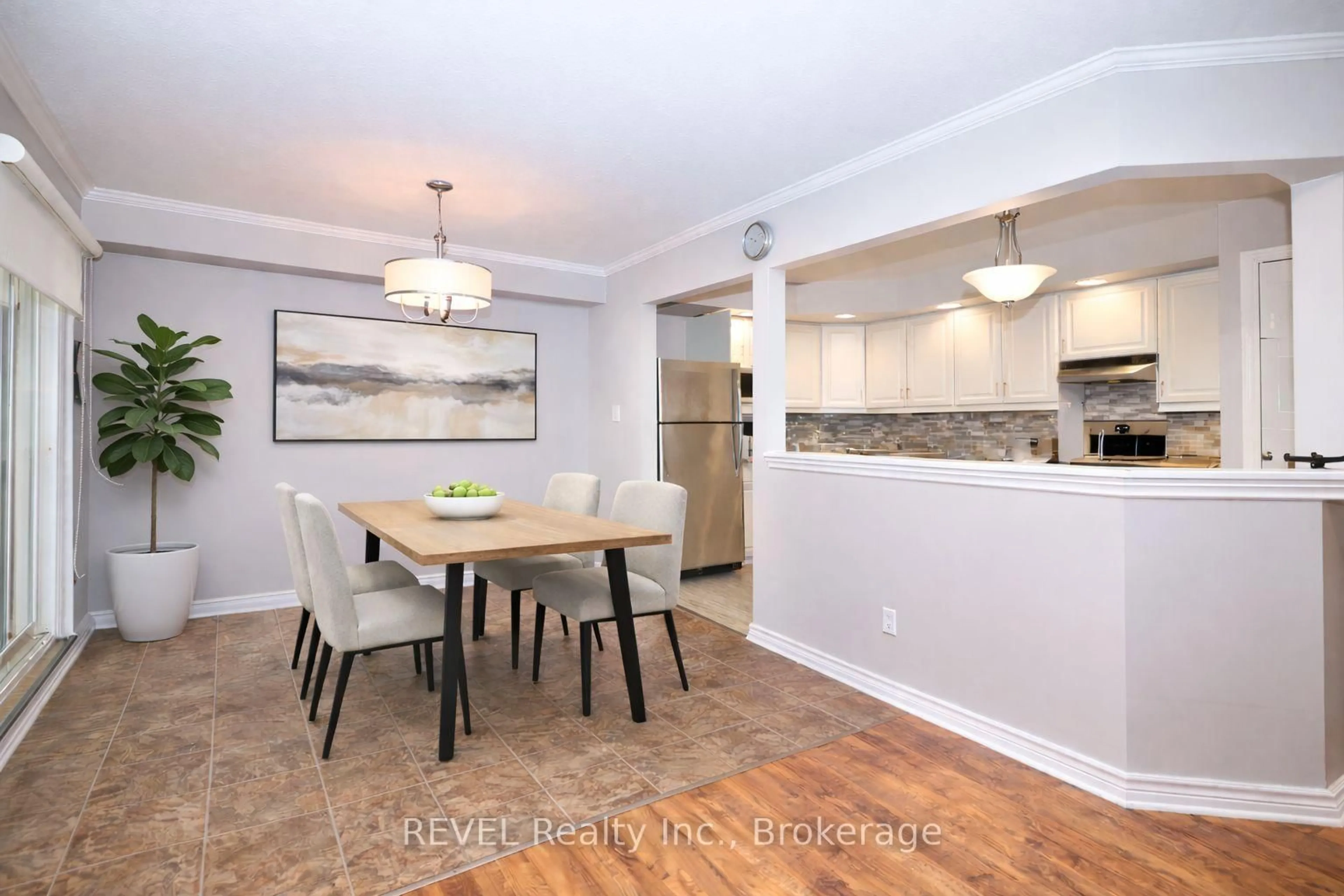 Open concept kitchen, wood/laminate floor for 1061 Vansickle Rd #106, St. Catharines Ontario L2S 2X4