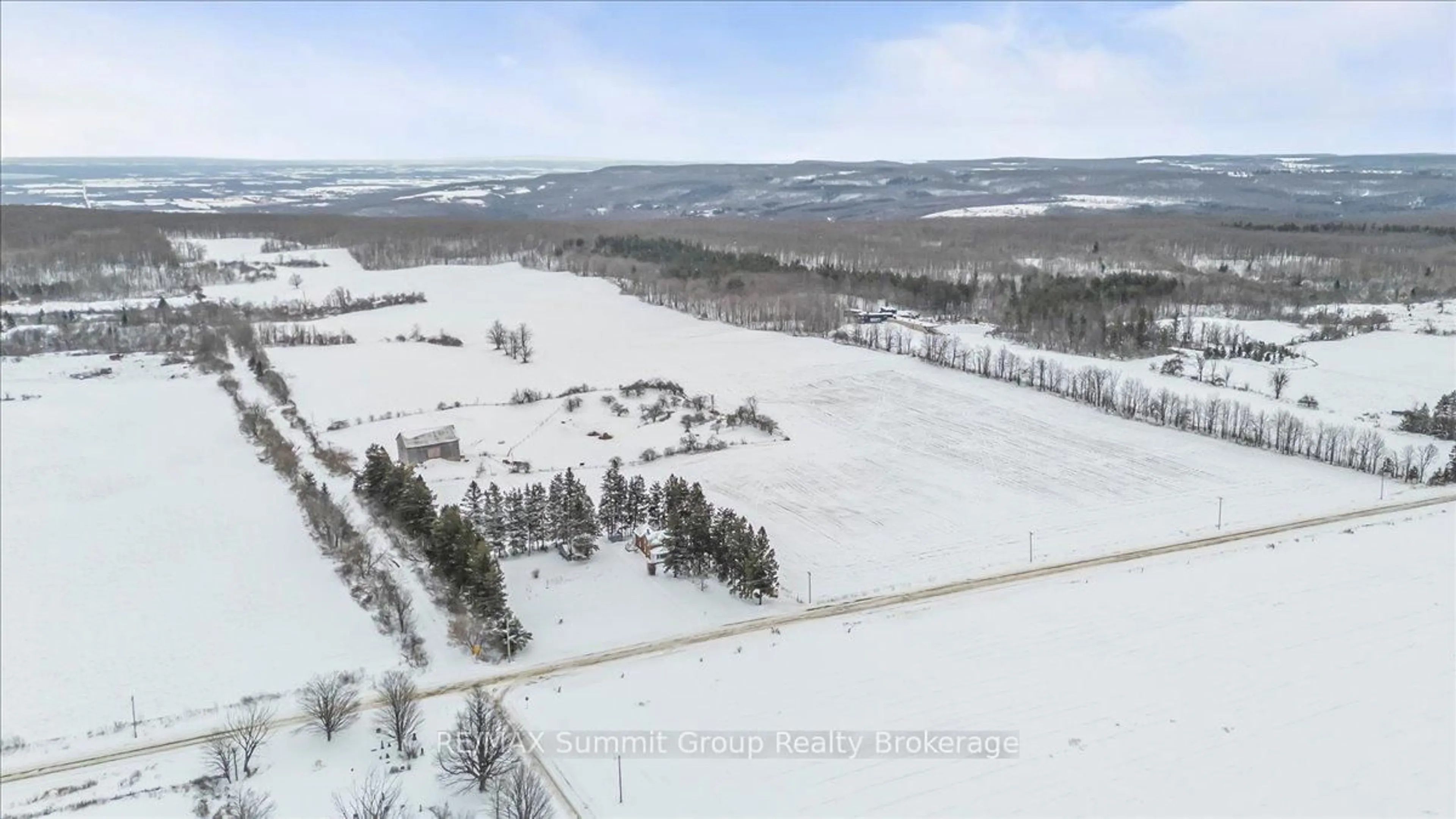 A pic from outside/outdoor area/front of a property/back of a property/a pic from drone, forest/trees view for 595181 4th Line, Blue Mountains Ontario N0H 2E0