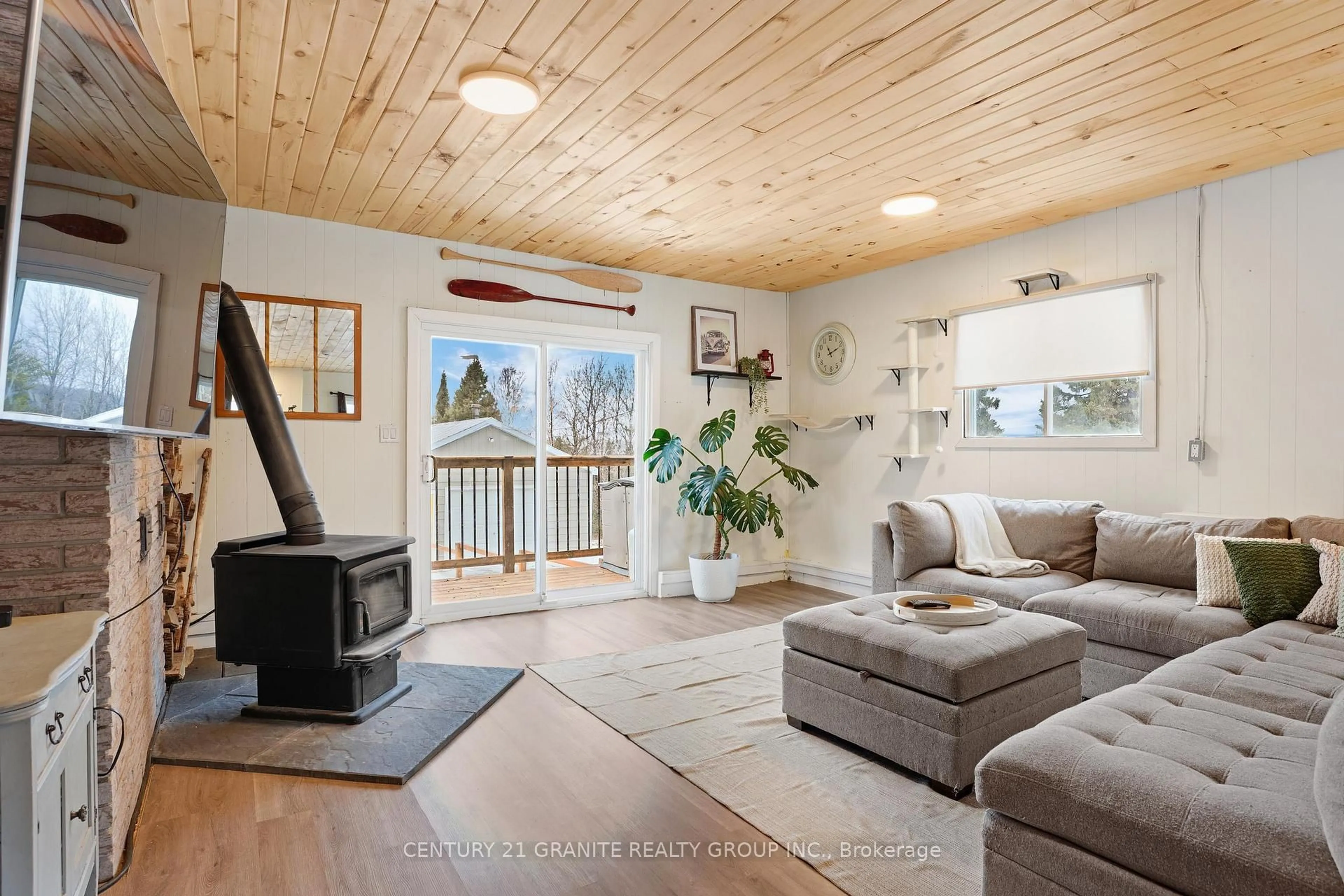 Living room with furniture, wood/laminate floor for 80 Paradise Rd, South Algonquin Ontario K0J 2M0