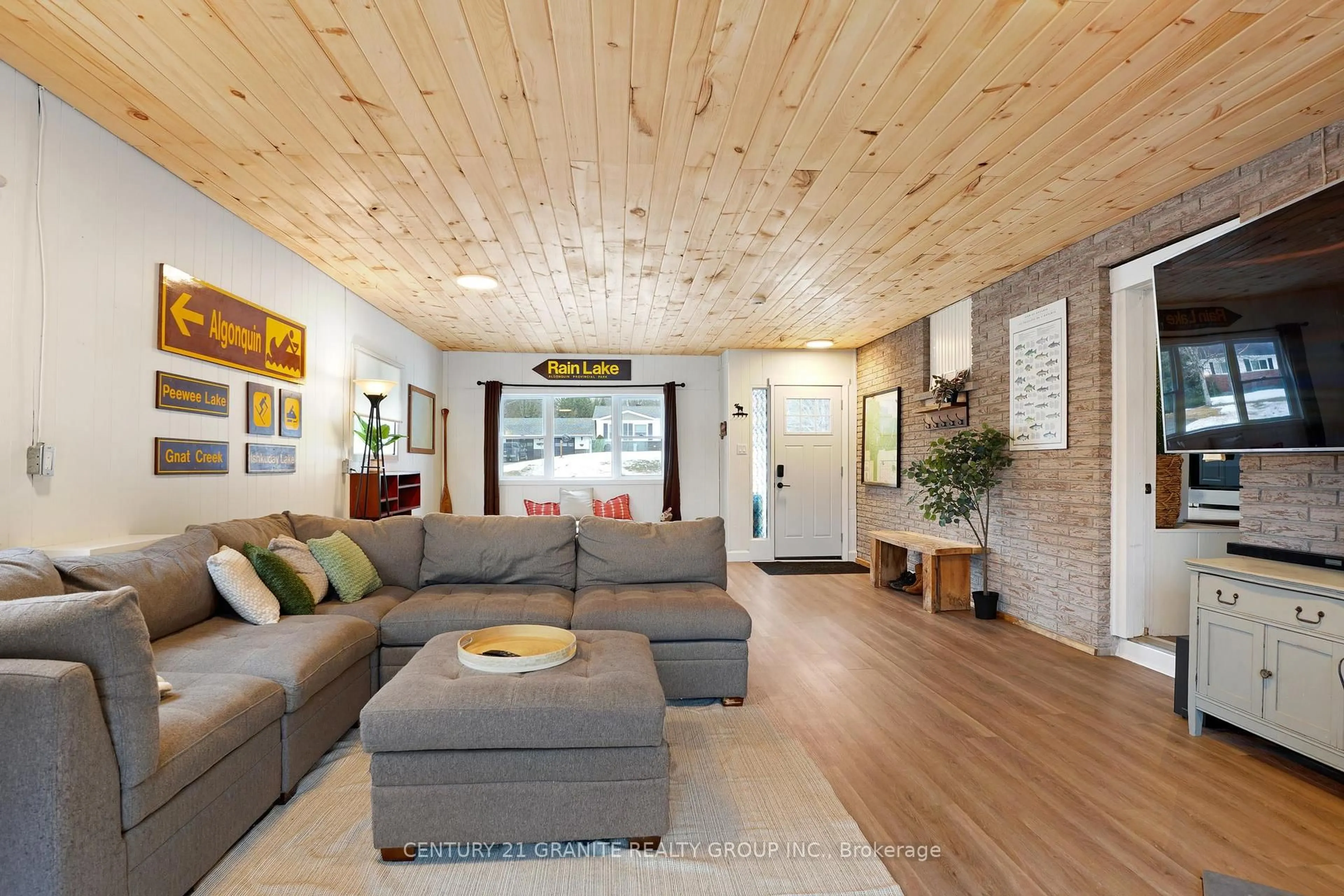 Living room with furniture, wood/laminate floor for 80 Paradise Rd, South Algonquin Ontario K0J 2M0