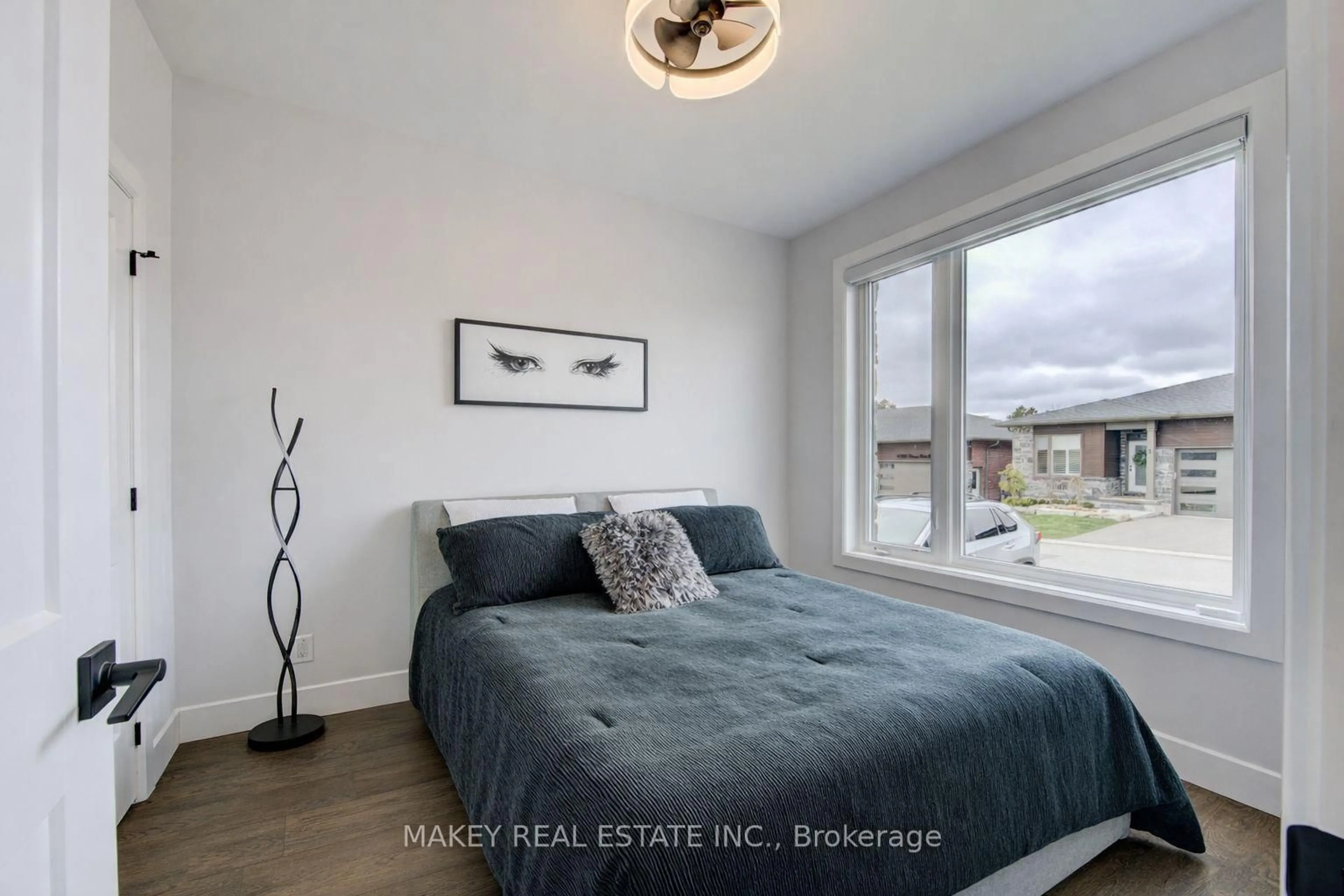 Bedroom with bed, wood/laminate floor for 269 Pittock Park Rd #17, Woodstock Ontario N4S 7W2