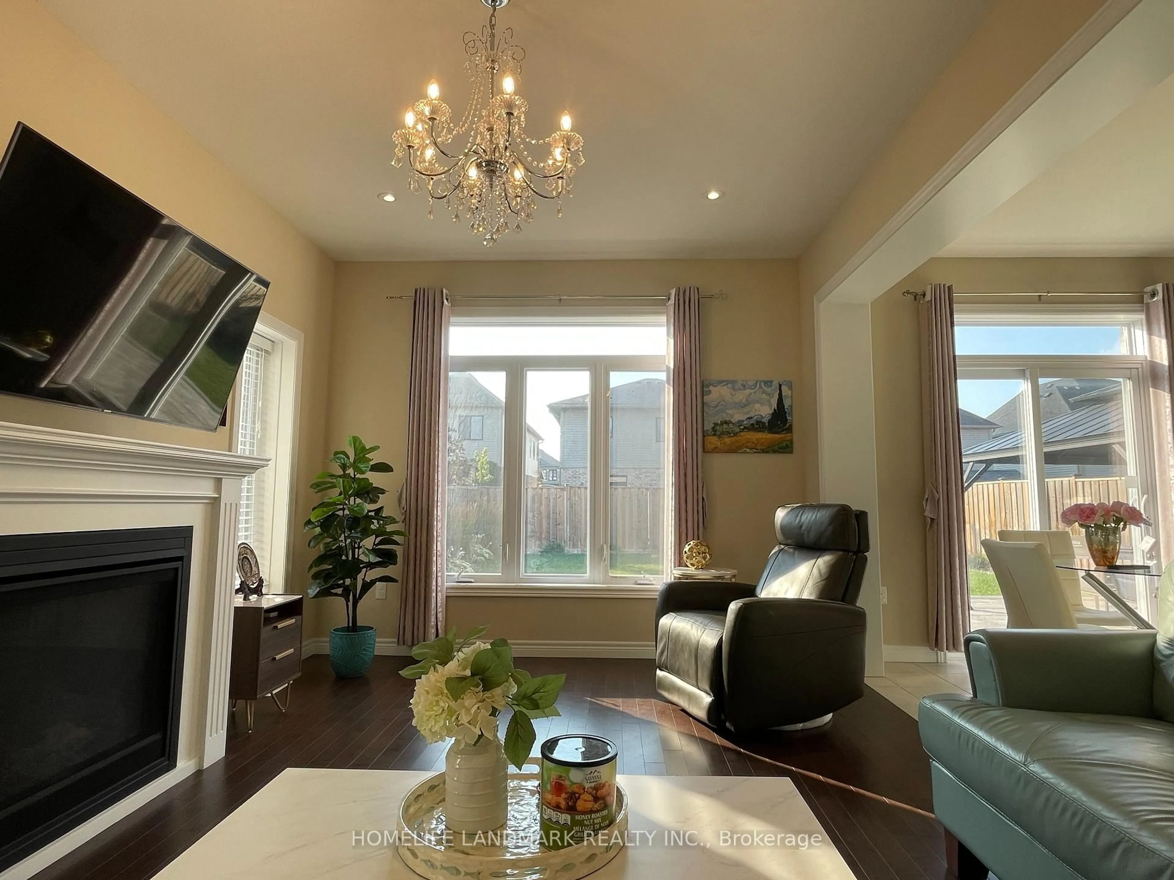 Living room with furniture, wood/laminate floor for 94 Ambrous Cres, Guelph Ontario N1G 0E4