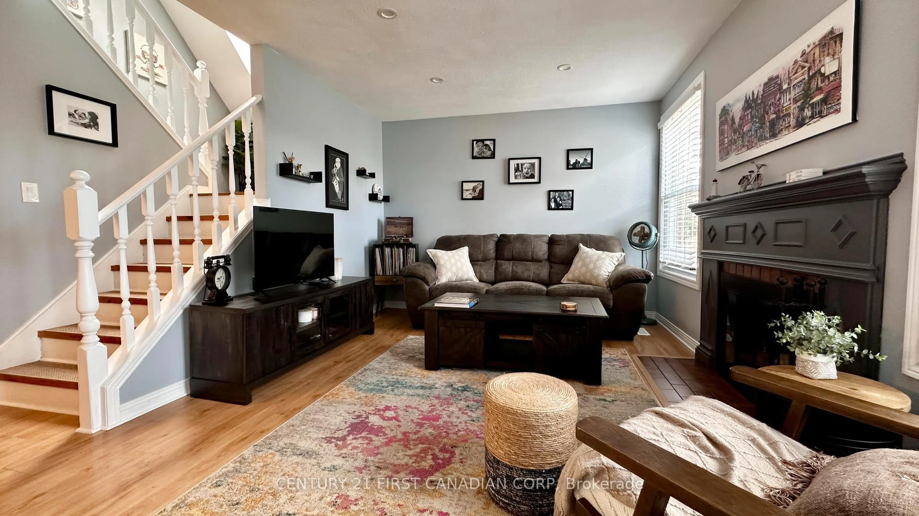 Living room with furniture, wood/laminate floor for 15 Chancton Cres, London South Ontario N6E 2Y5