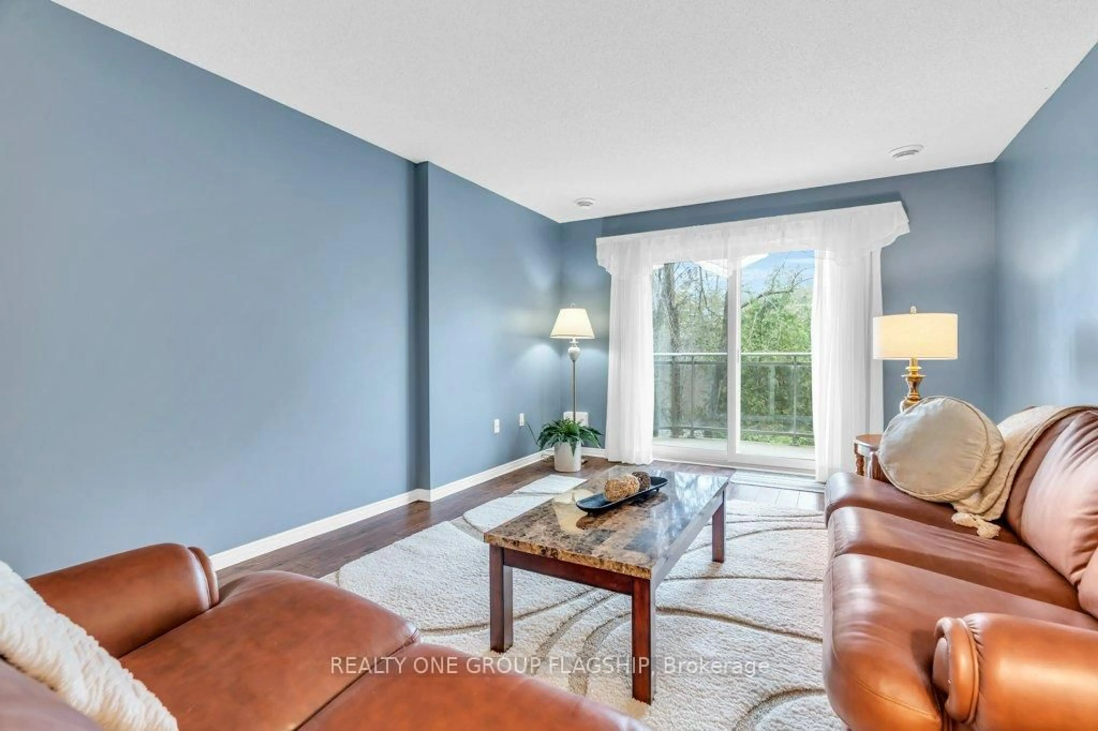 Living room with furniture, ceramic/tile floor for 245 queen St #202, Centre Wellington Ontario N1M 3R6