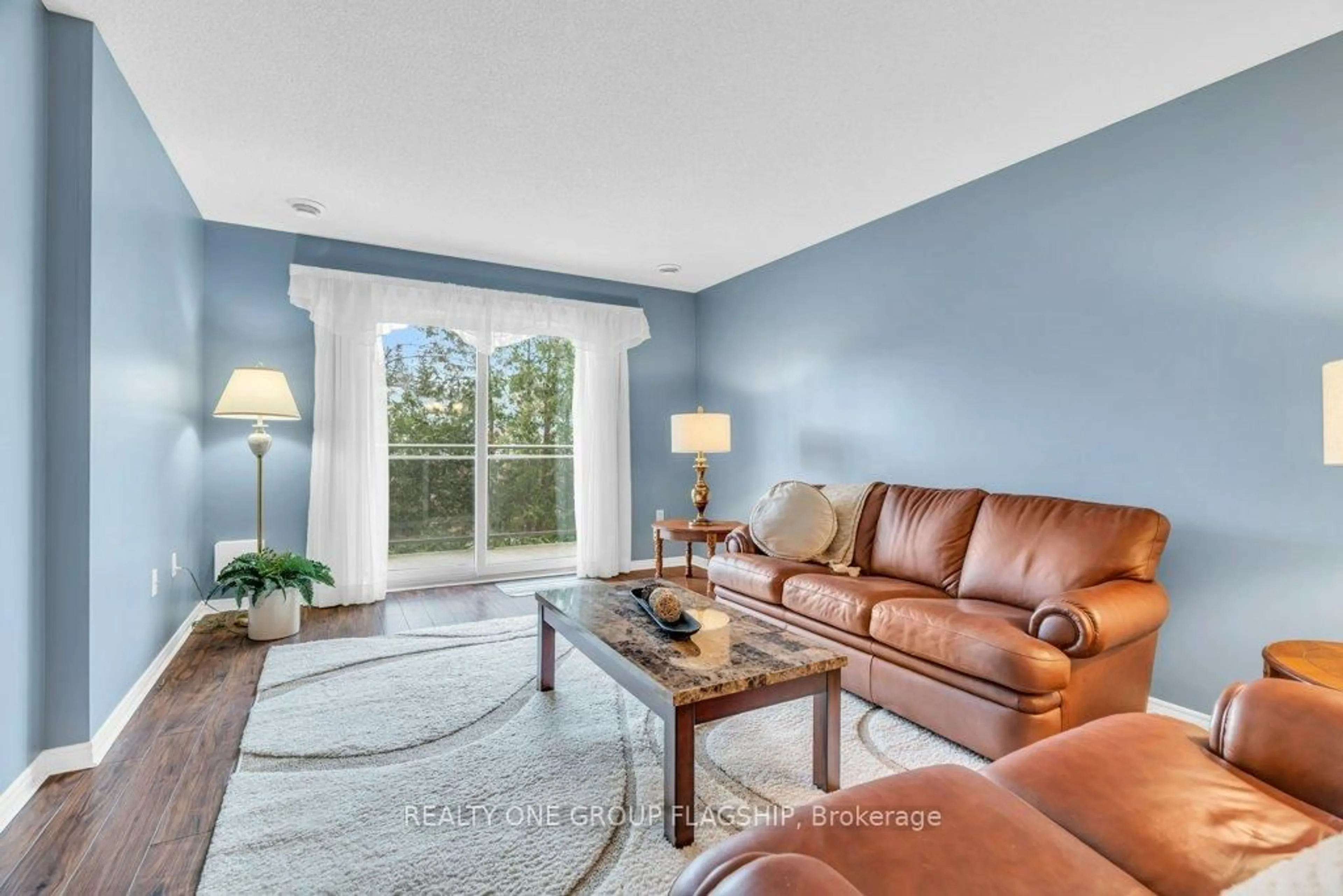 Living room with furniture, ceramic/tile floor for 245 queen St #202, Centre Wellington Ontario N1M 3R6