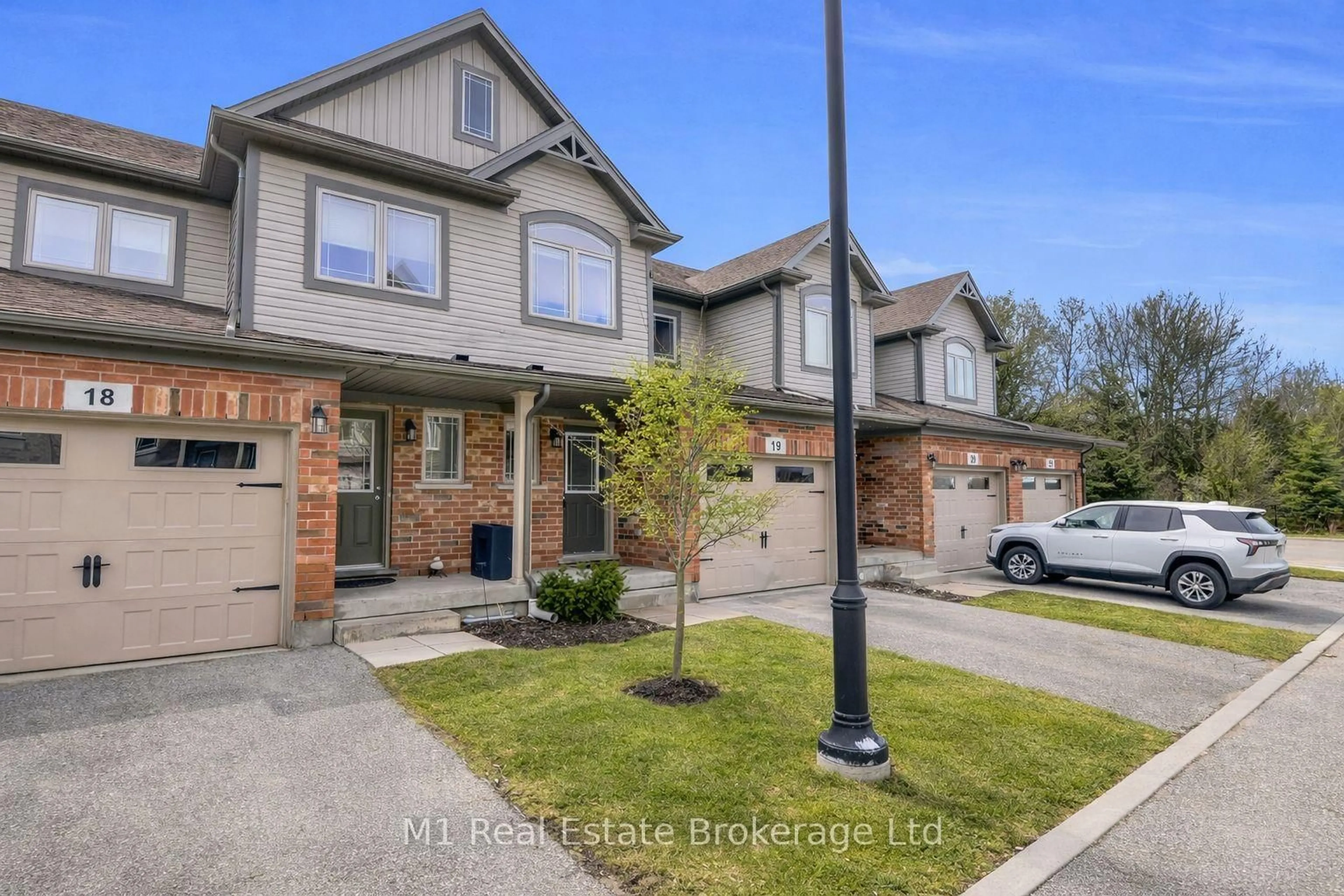 Home with brick exterior material, street for 66 Eastview Rd #19, Guelph Ontario N1E 0N1