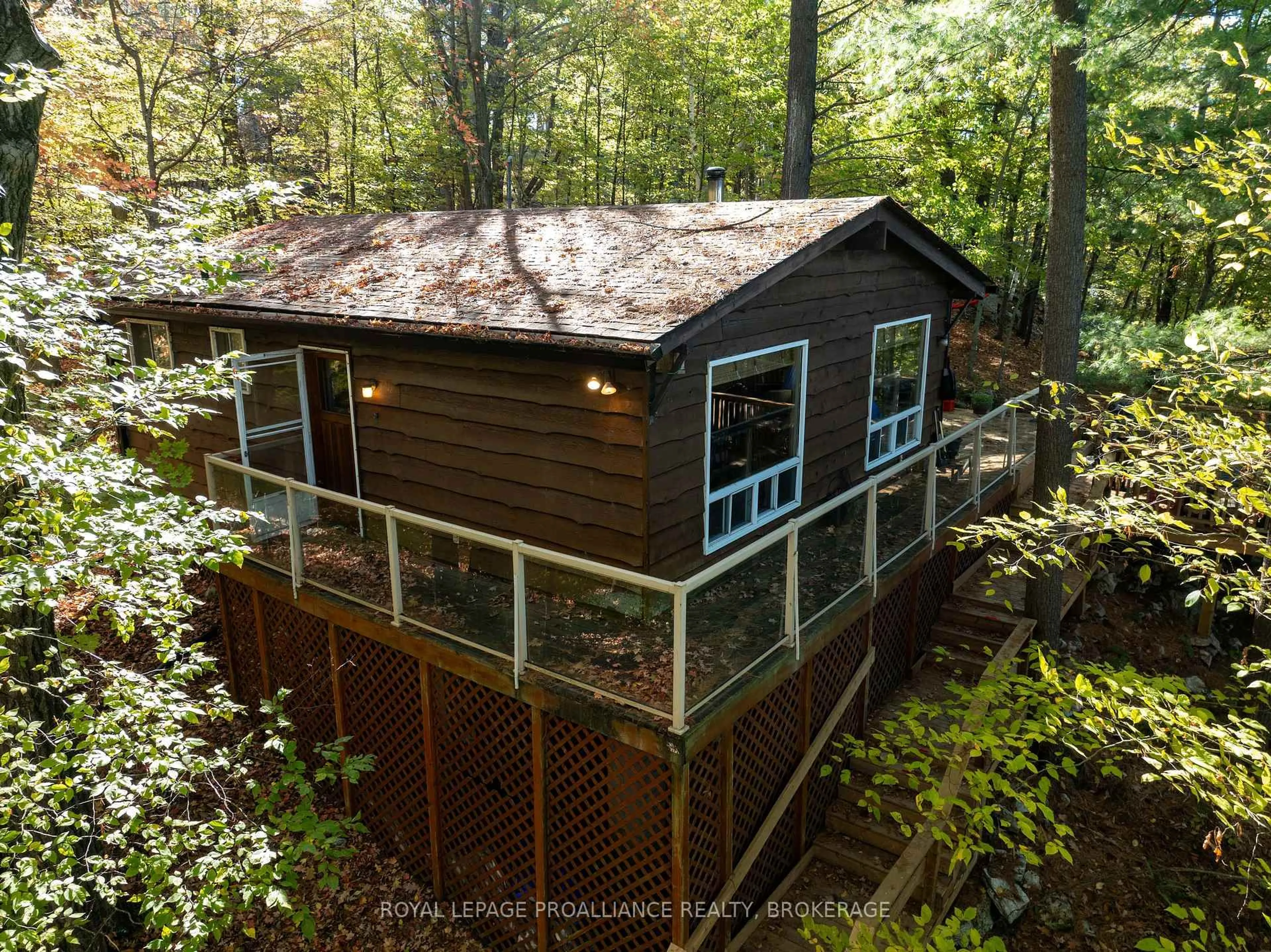 A pic from outside/outdoor area/front of a property/back of a property/a pic from drone, forest/trees view for 450 Brooks Point Rd, Rideau Lakes Ontario K0G 1E0