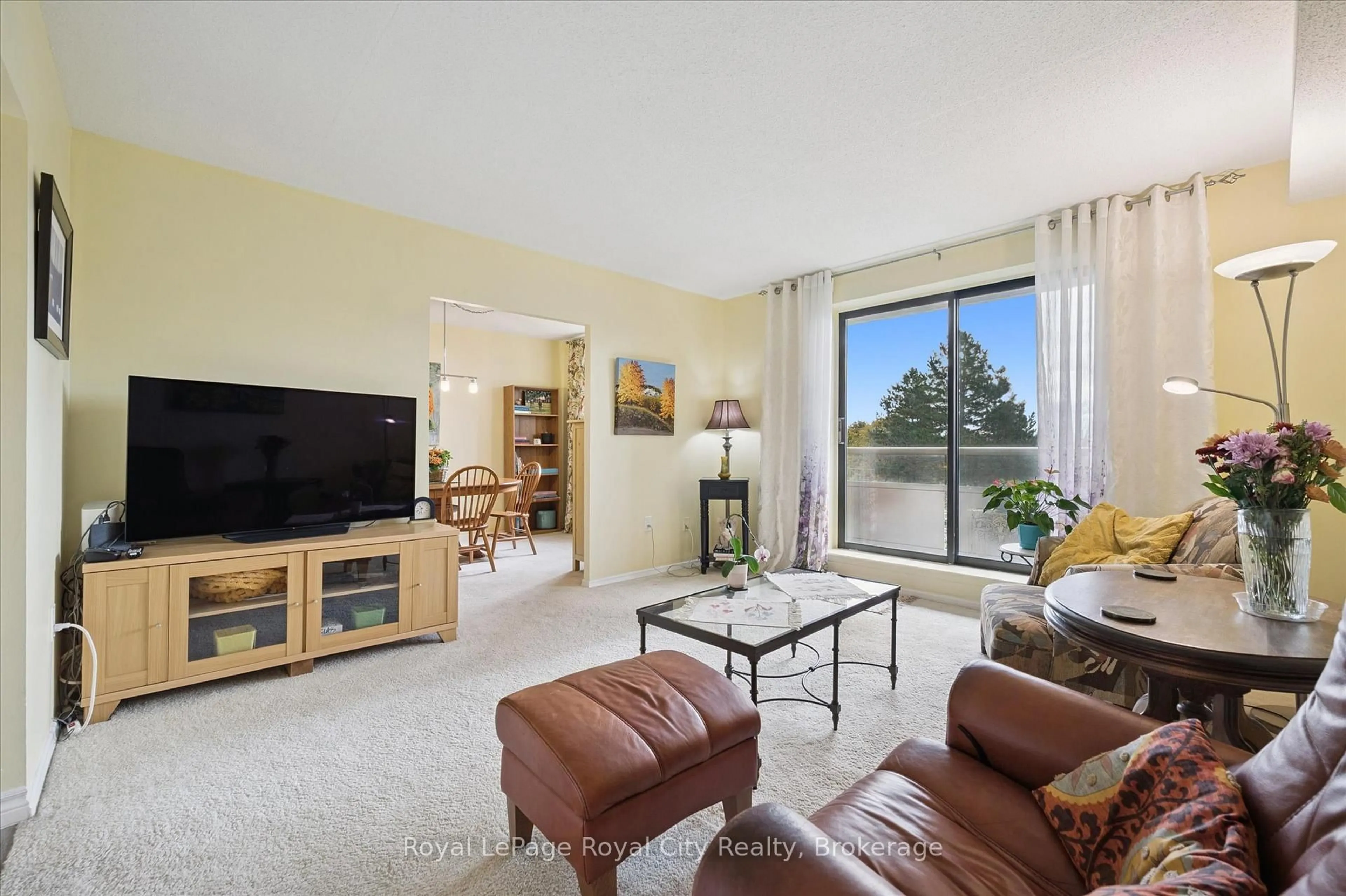 Living room with furniture, unknown for 93 Westwood Rd #403, Guelph Ontario N1H 7J7