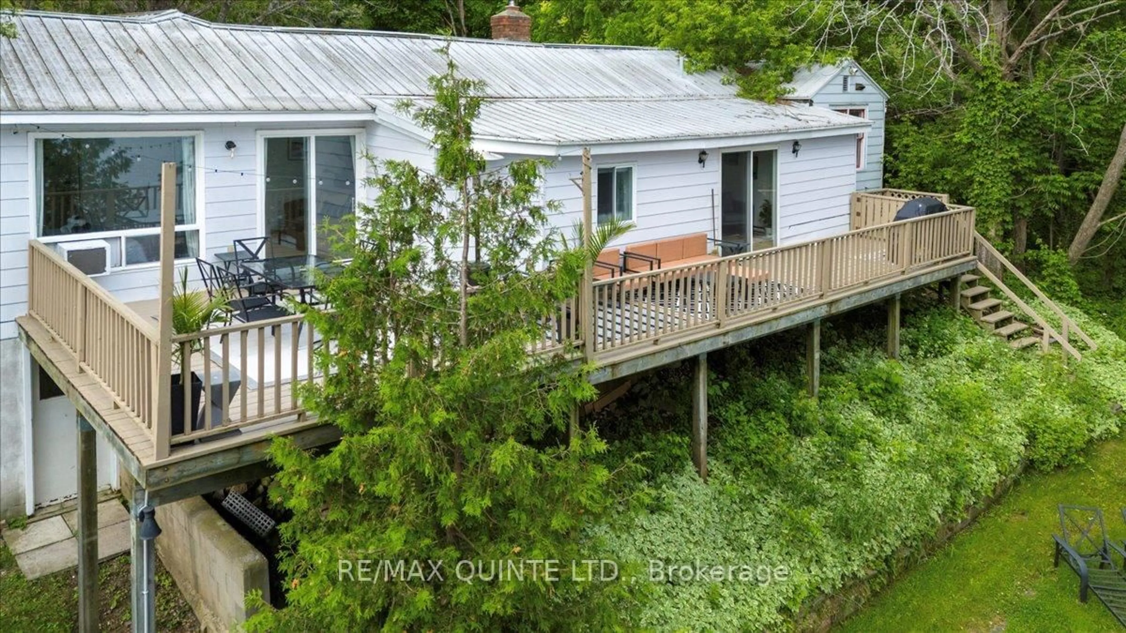 A pic from outside/outdoor area/front of a property/back of a property/a pic from drone, water/lake/river/ocean view for 11364 Loyalist Pkwy, Prince Edward County Ontario K0K 2T0