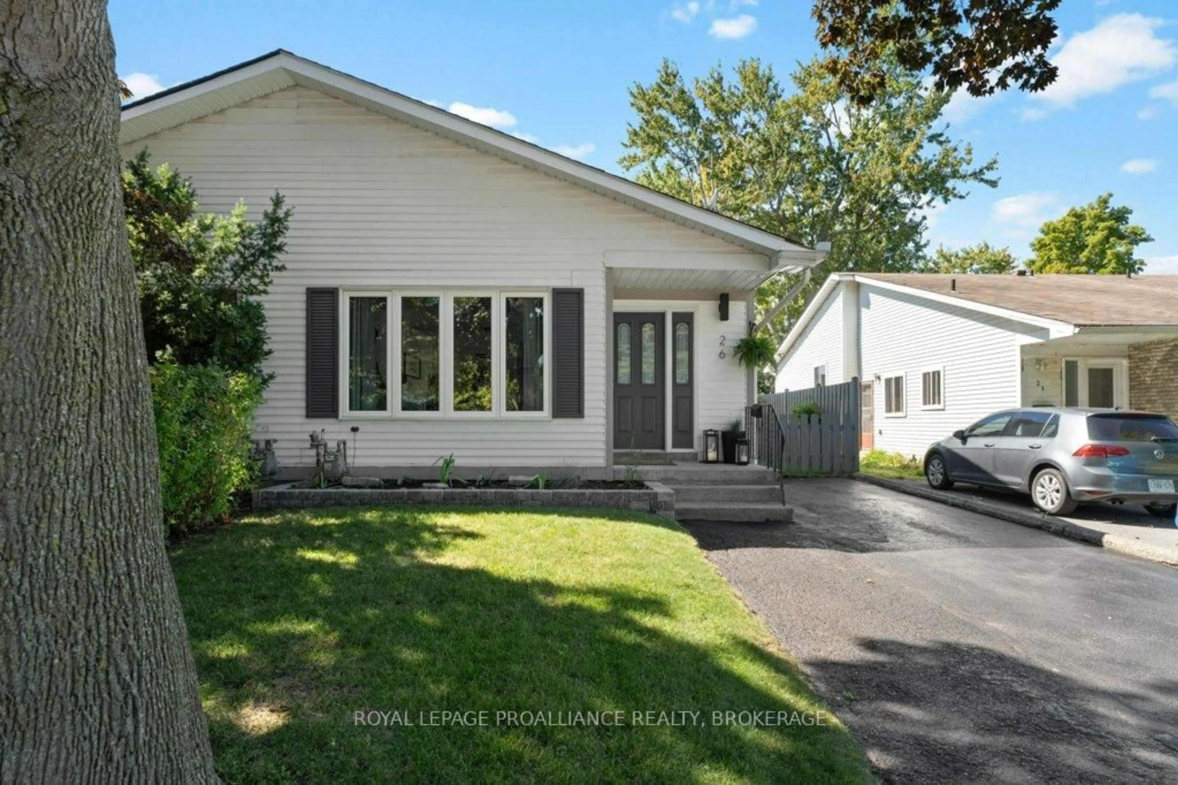 Home with vinyl exterior material, street for 26 Woodstone Cres, Kingston Ontario K7M 6K9