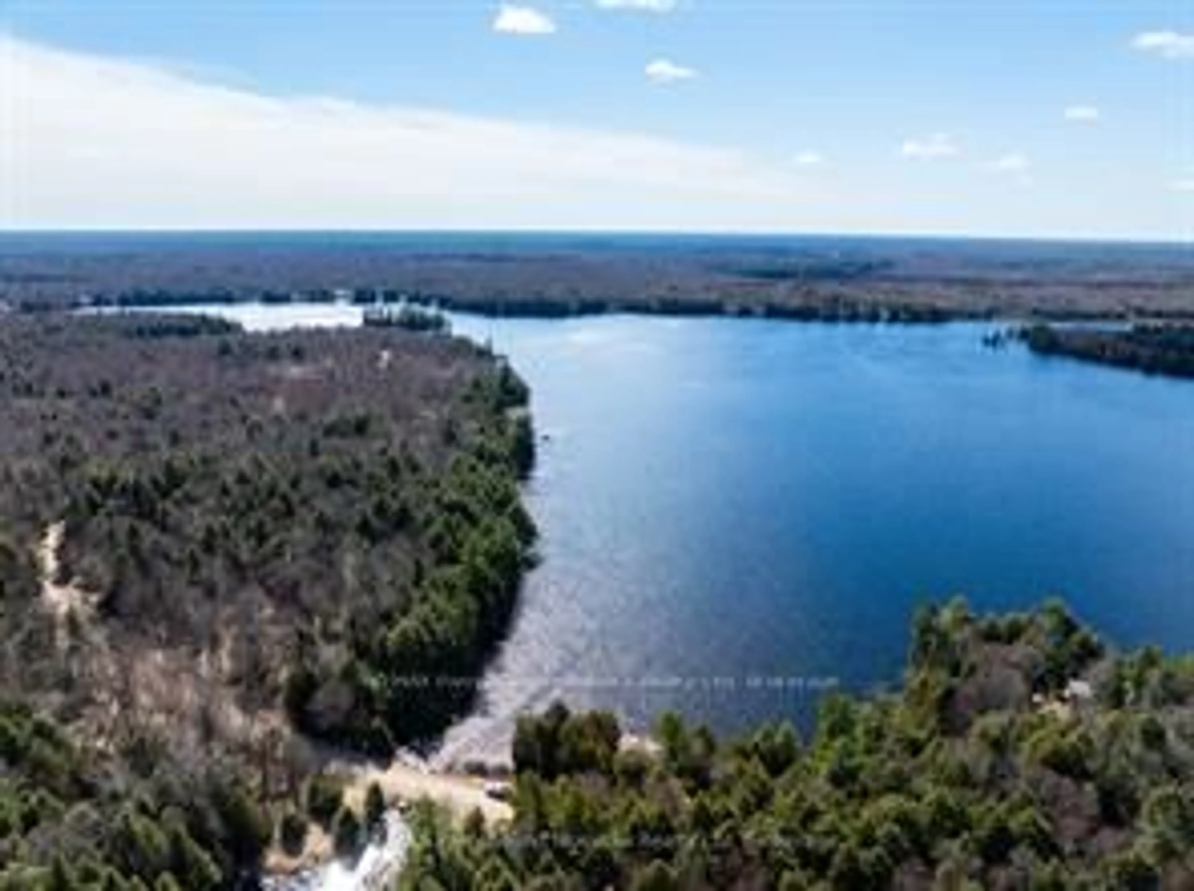 A pic from outside/outdoor area/front of a property/back of a property/a pic from drone, water/lake/river/ocean view for 764 EAST BEAR LAKE Rd, McMurrich/Monteith Ontario P0A 1Y0