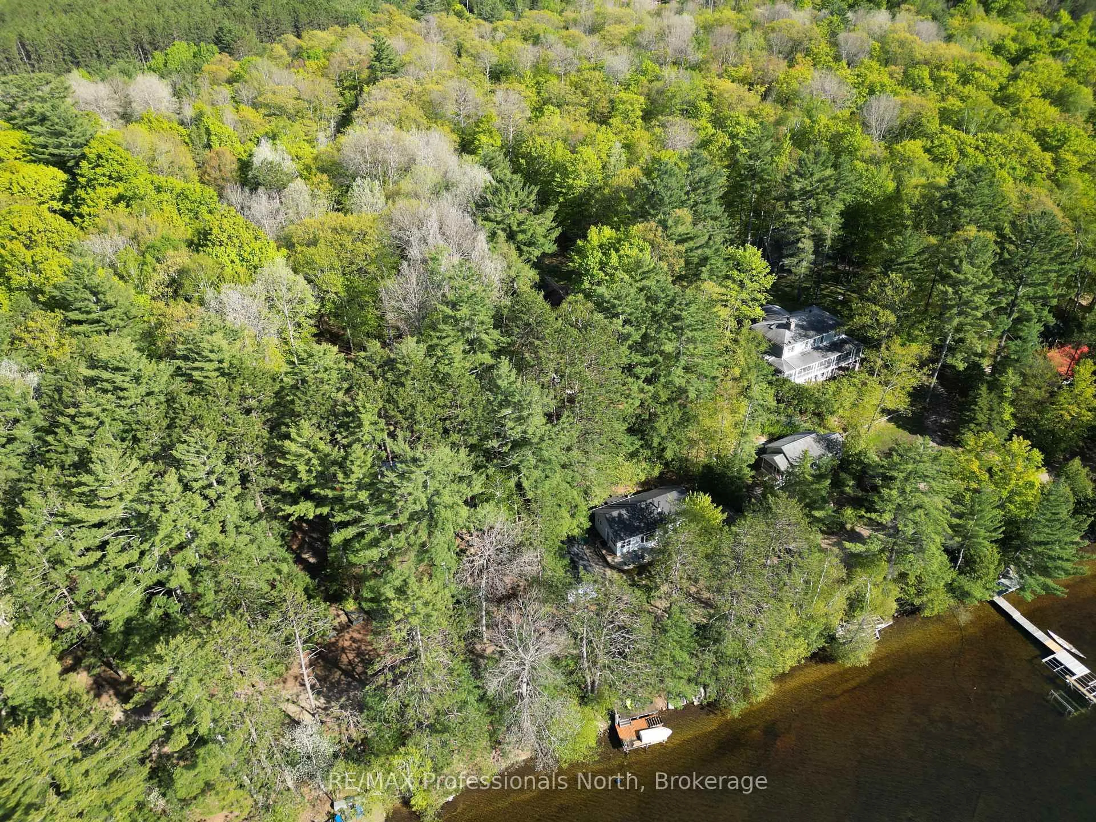 A pic from outside/outdoor area/front of a property/back of a property/a pic from drone, water/lake/river/ocean view for 15111 Highway 35, Minden Hills Ontario K0M 2K0