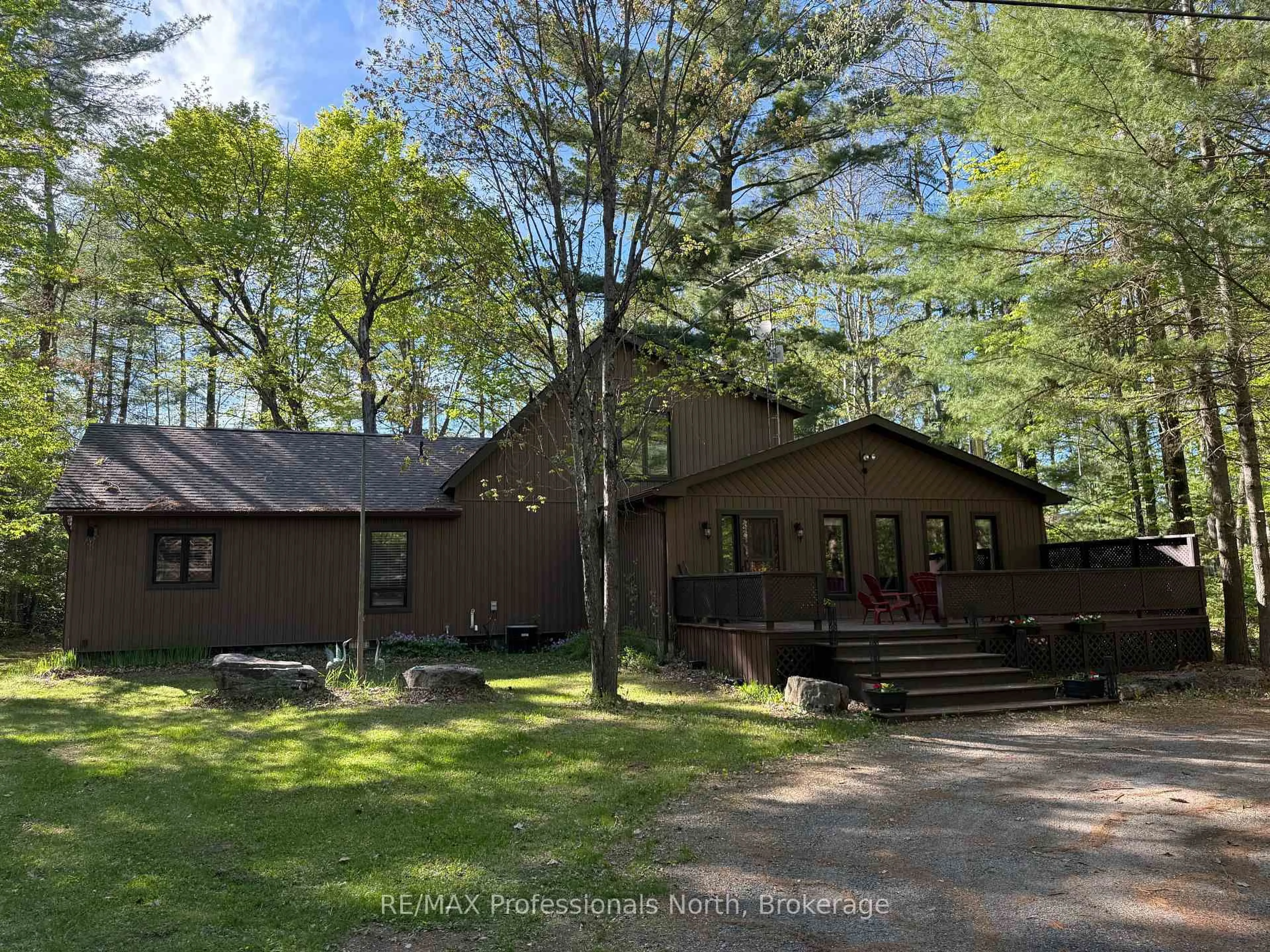 A pic from outside/outdoor area/front of a property/back of a property/a pic from drone, forest/trees view for 15111 Highway 35, Minden Hills Ontario K0M 2K0
