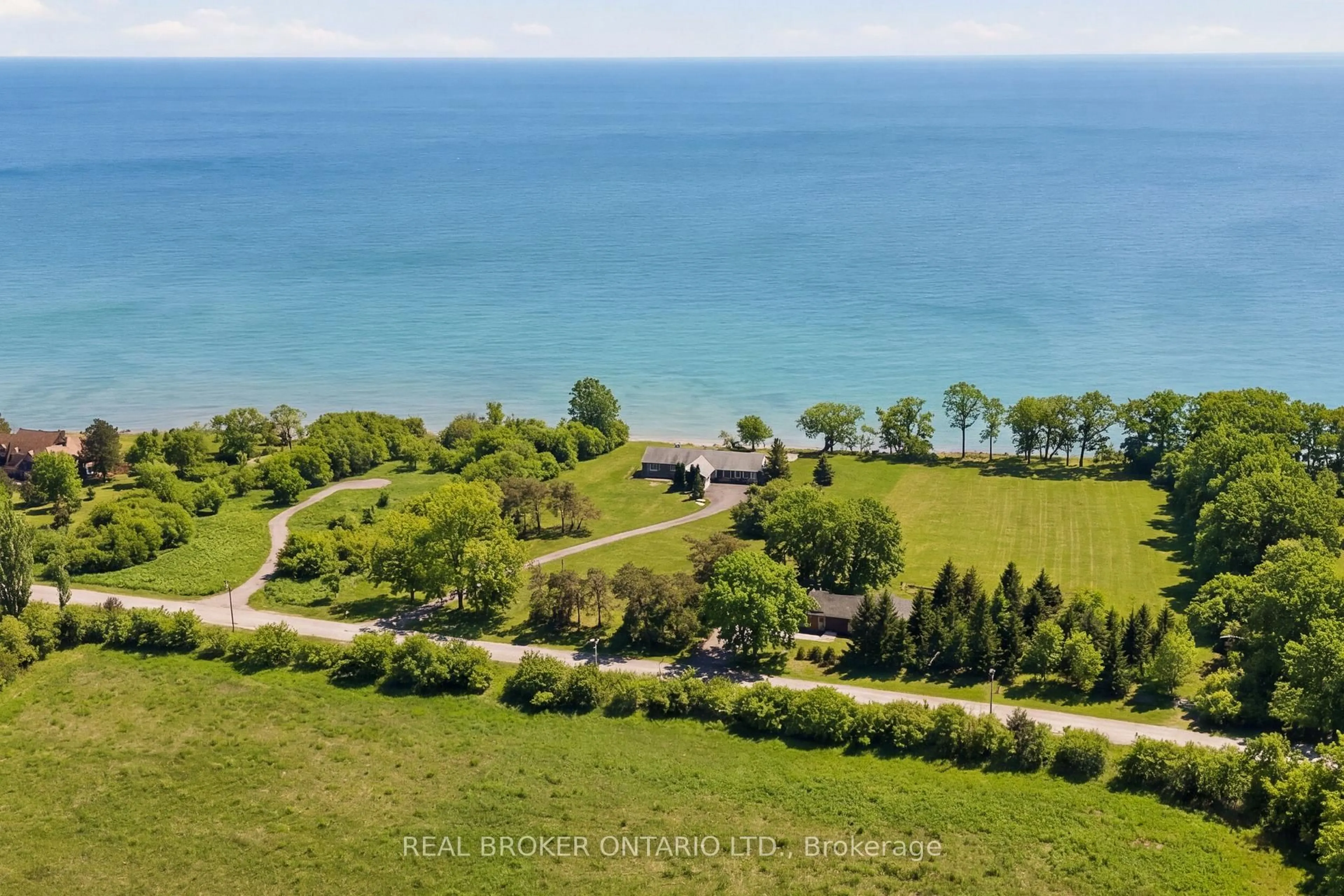 A pic from outside/outdoor area/front of a property/back of a property/a pic from drone, water/lake/river/ocean view for 1105 Huyck's Point Rd, Prince Edward County Ontario K0K 3L0