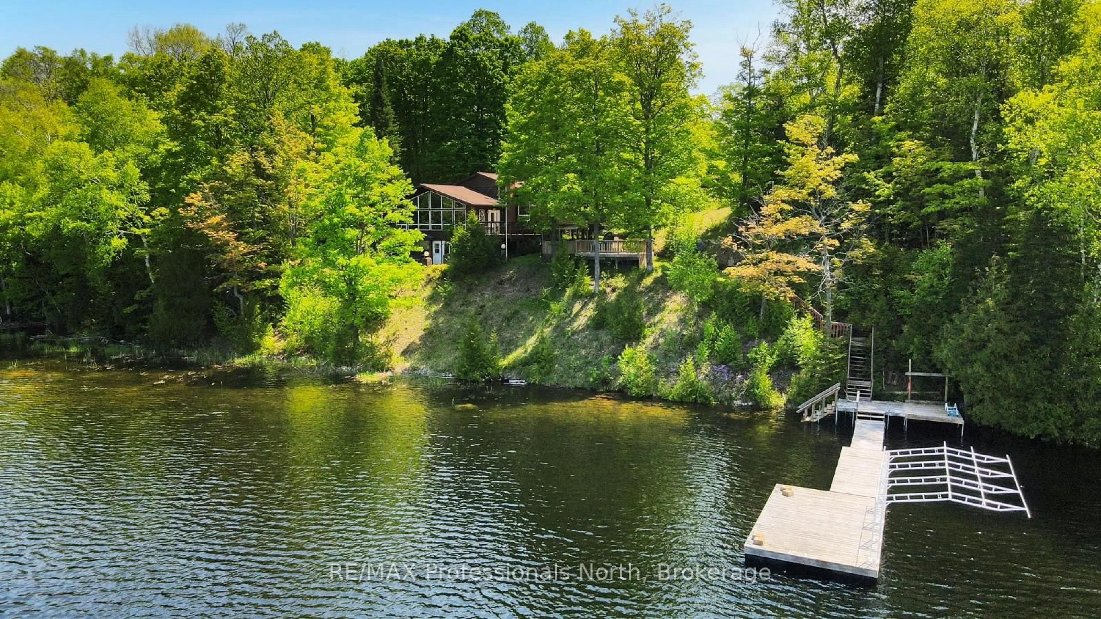 A pic from outside/outdoor area/front of a property/back of a property/a pic from drone, water/lake/river/ocean view for 1943 Essonville Line, Highlands East Ontario K0L 2Y0