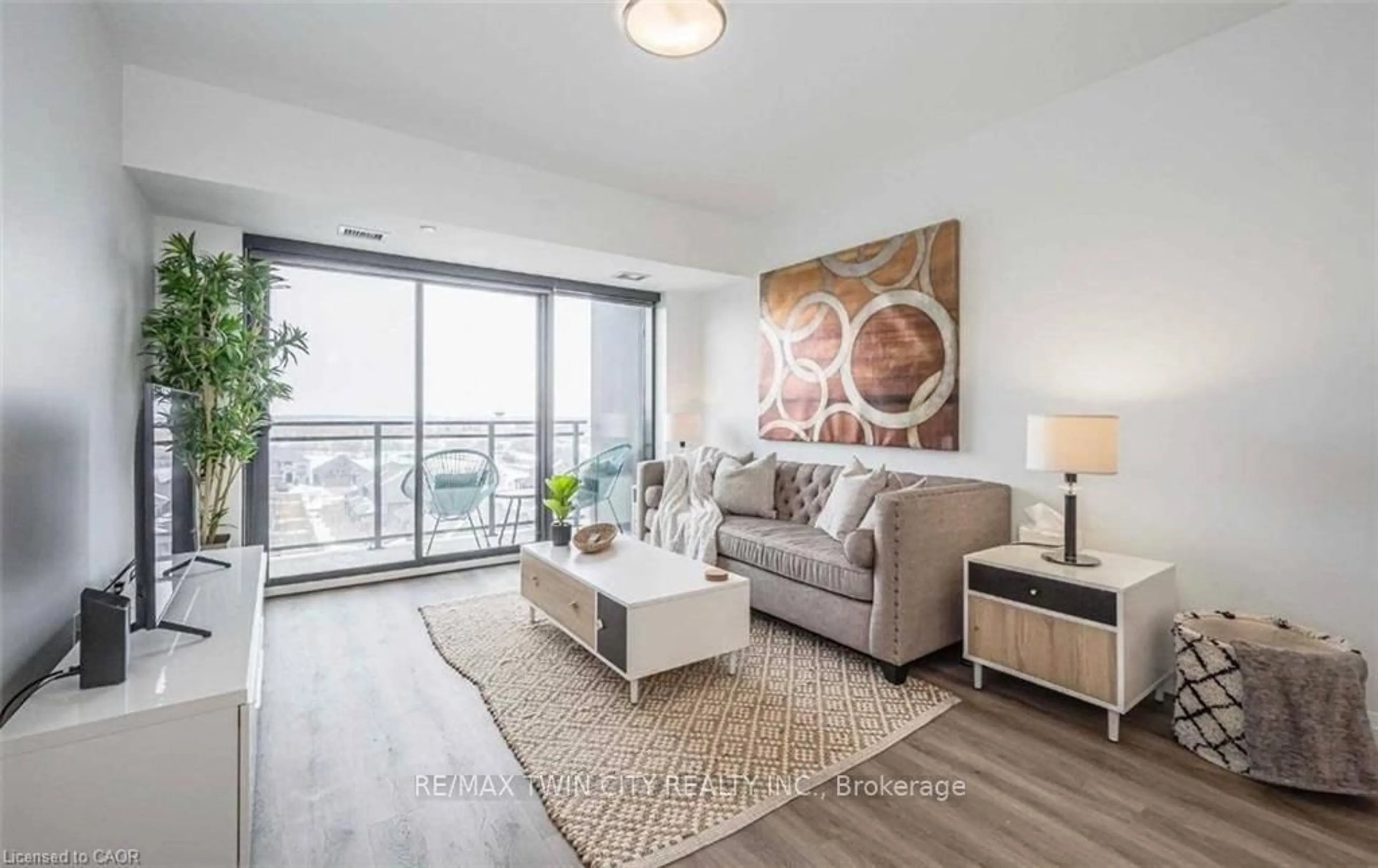 Living room with furniture, wood/laminate floor for 332 GOSLING Gdns #507, Guelph Ontario N1H 3A1