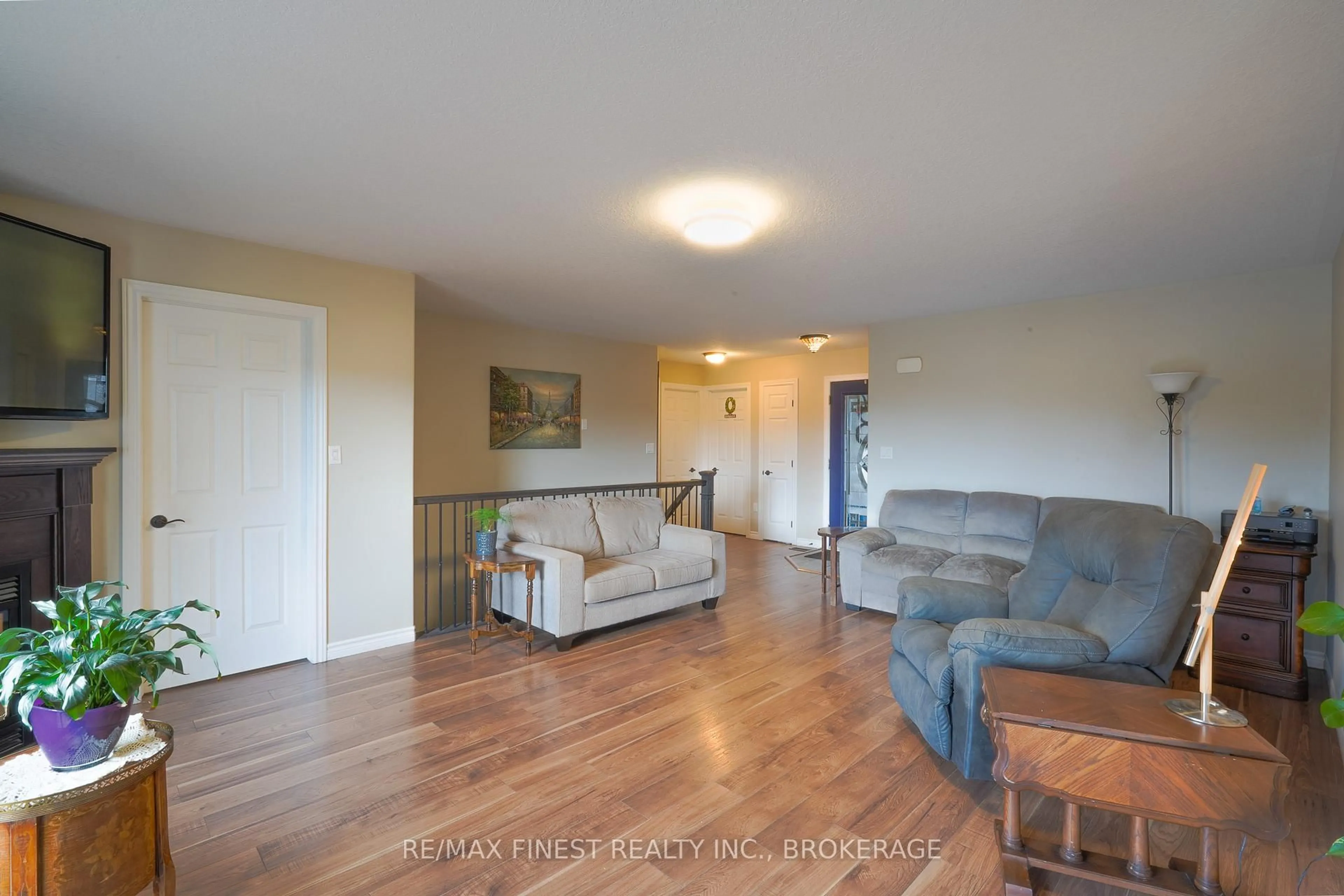 Living room with furniture, wood/laminate floor for 23 Creighton Dr, Bissett Creek Ontario K0H 2H0