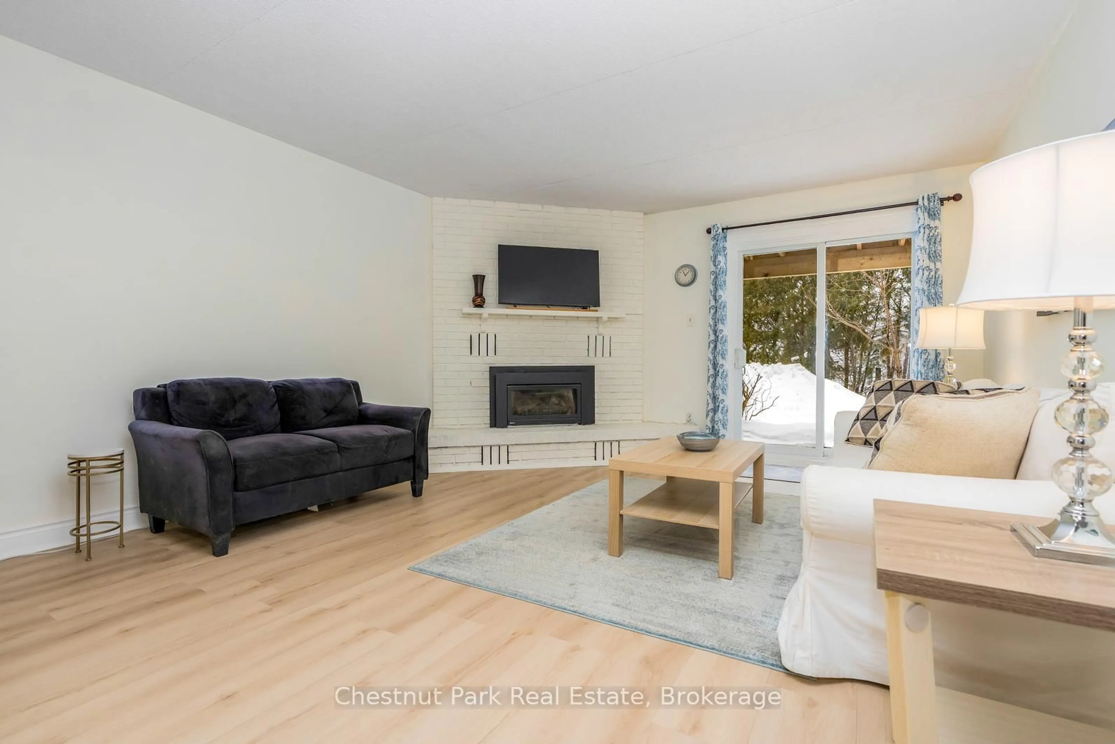 Living room with furniture, wood/laminate floor for 209472 Highway 26 #39, Blue Mountains Ontario L9Y 0V3