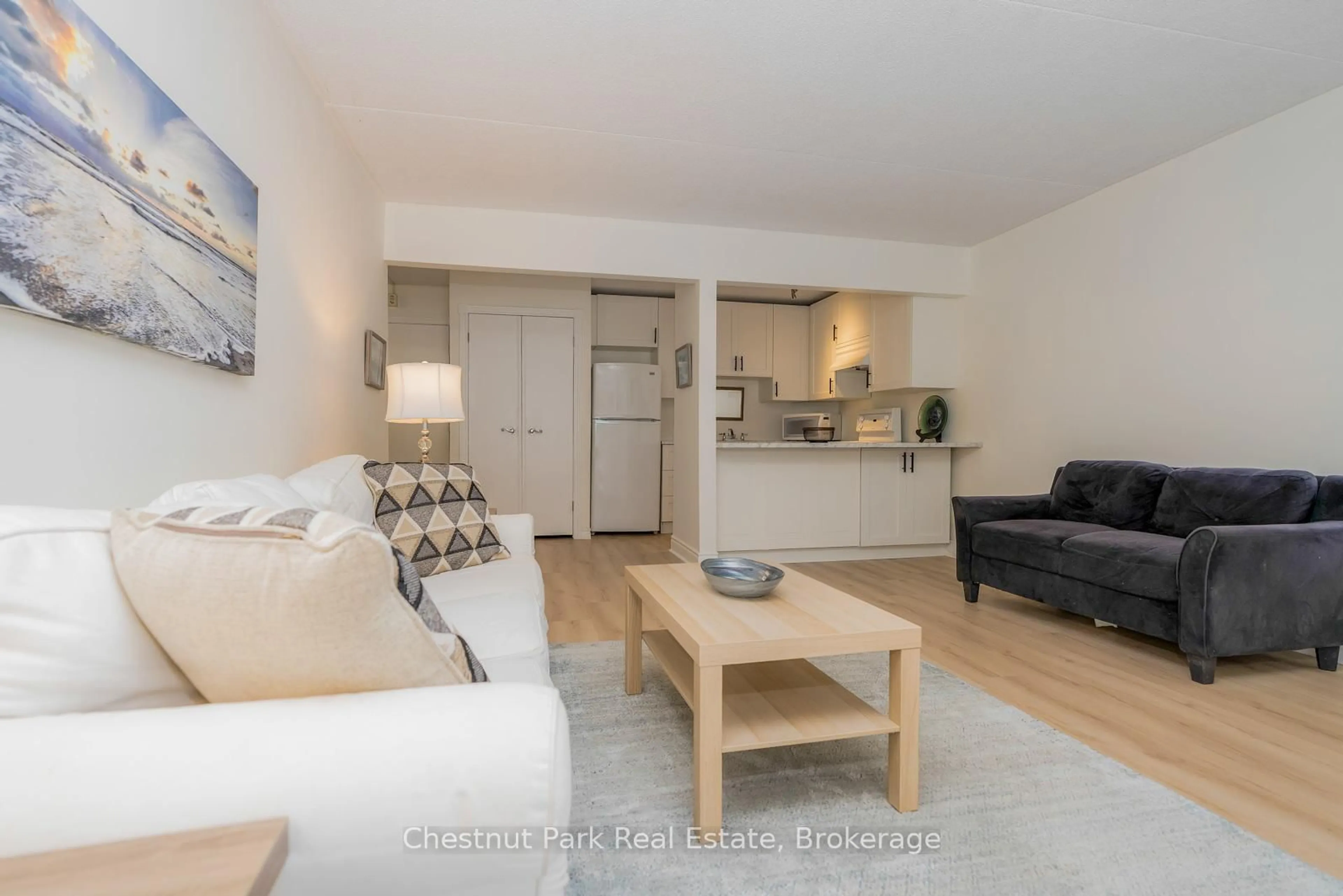 Living room with furniture, wood/laminate floor for 209472 Highway 26 #39, Blue Mountains Ontario L9Y 0V3